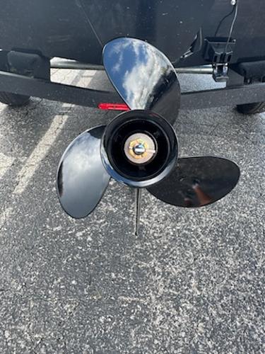 Propeller of 2025 Tracker Panfish 17 boat on asphalt surface.