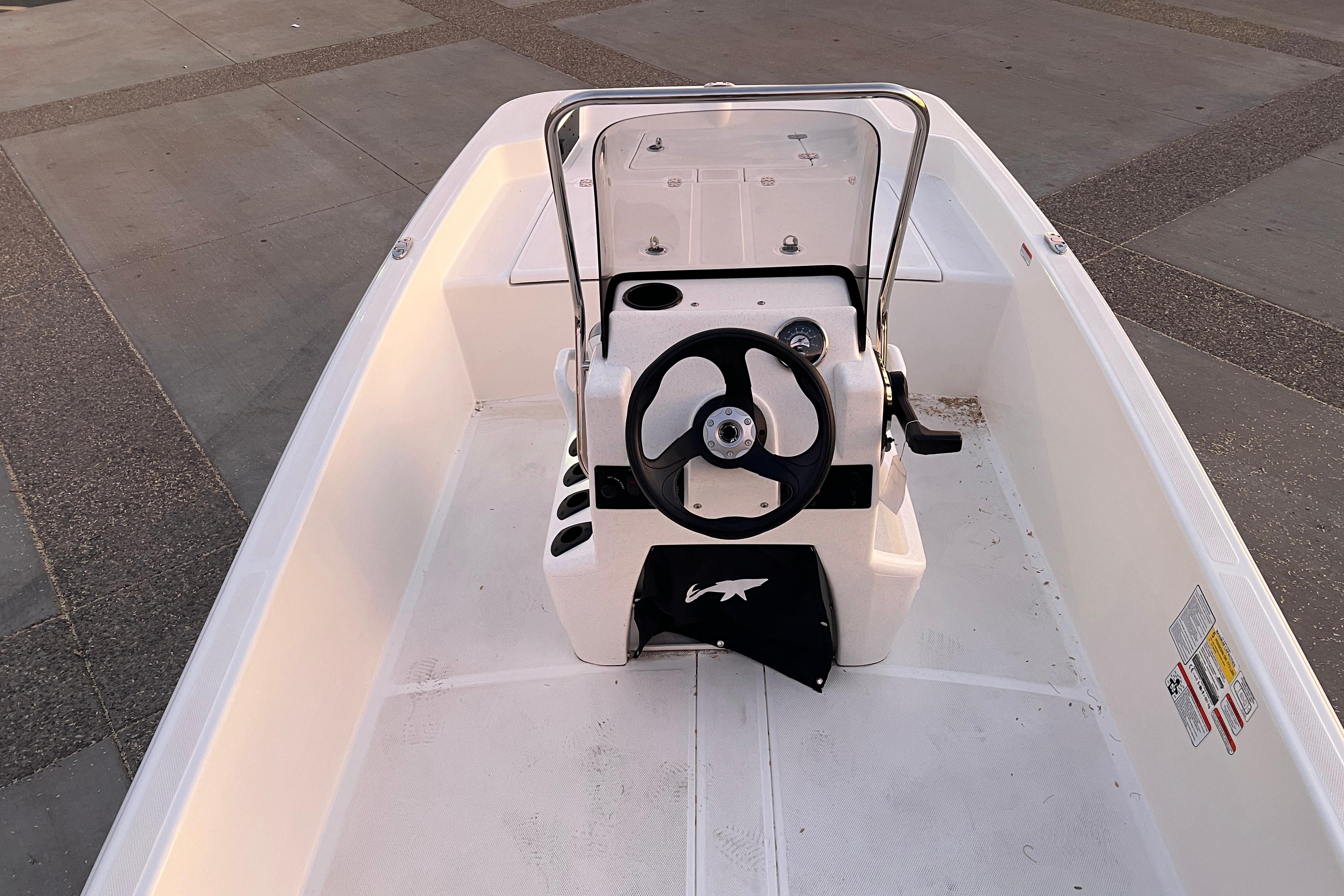 2025 Mako Pro Skiff 15 CC boat interior with steering console.