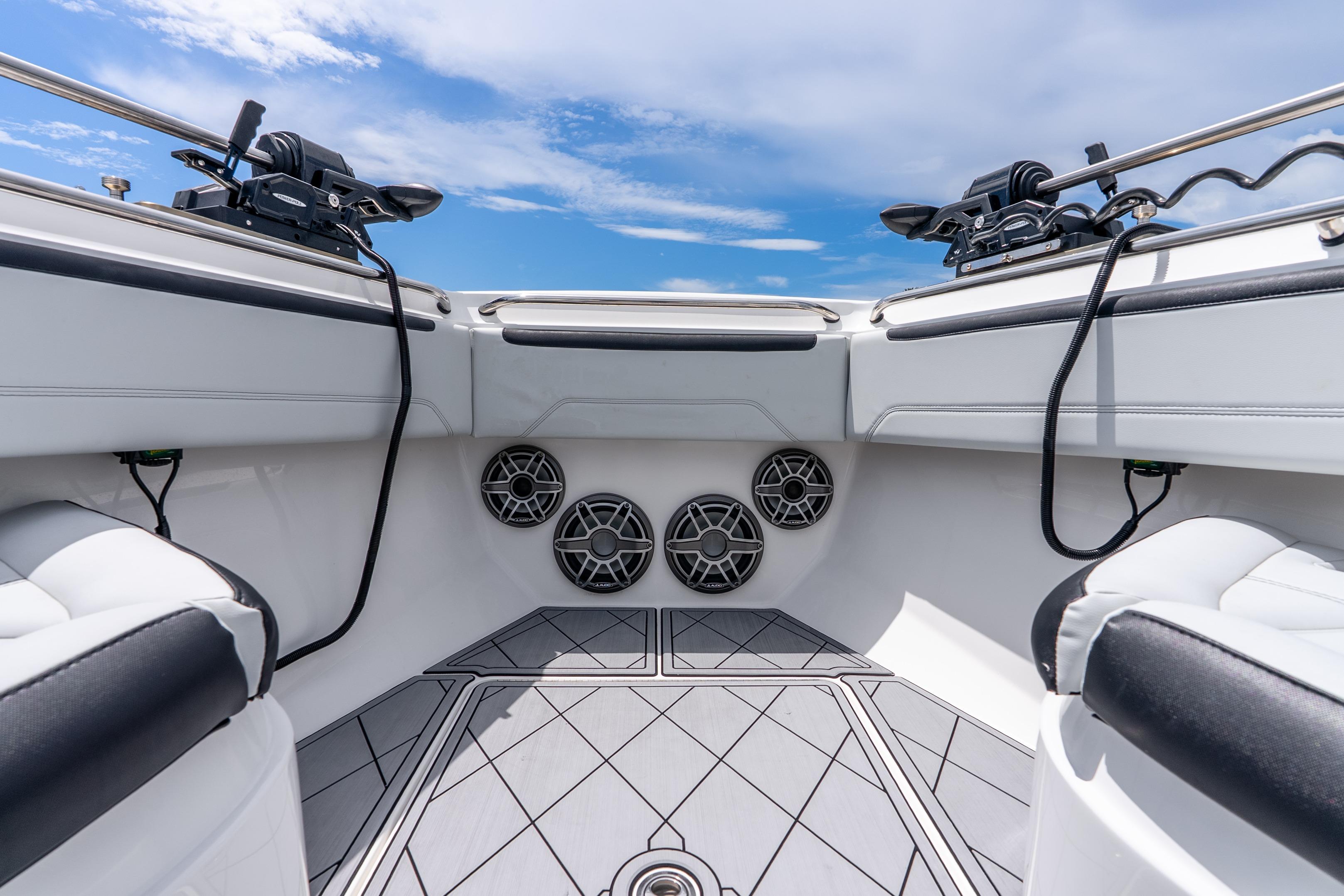 Interior view of 2024 Nor-Tech 452 Super Fish boat, featuring speakers and seating.