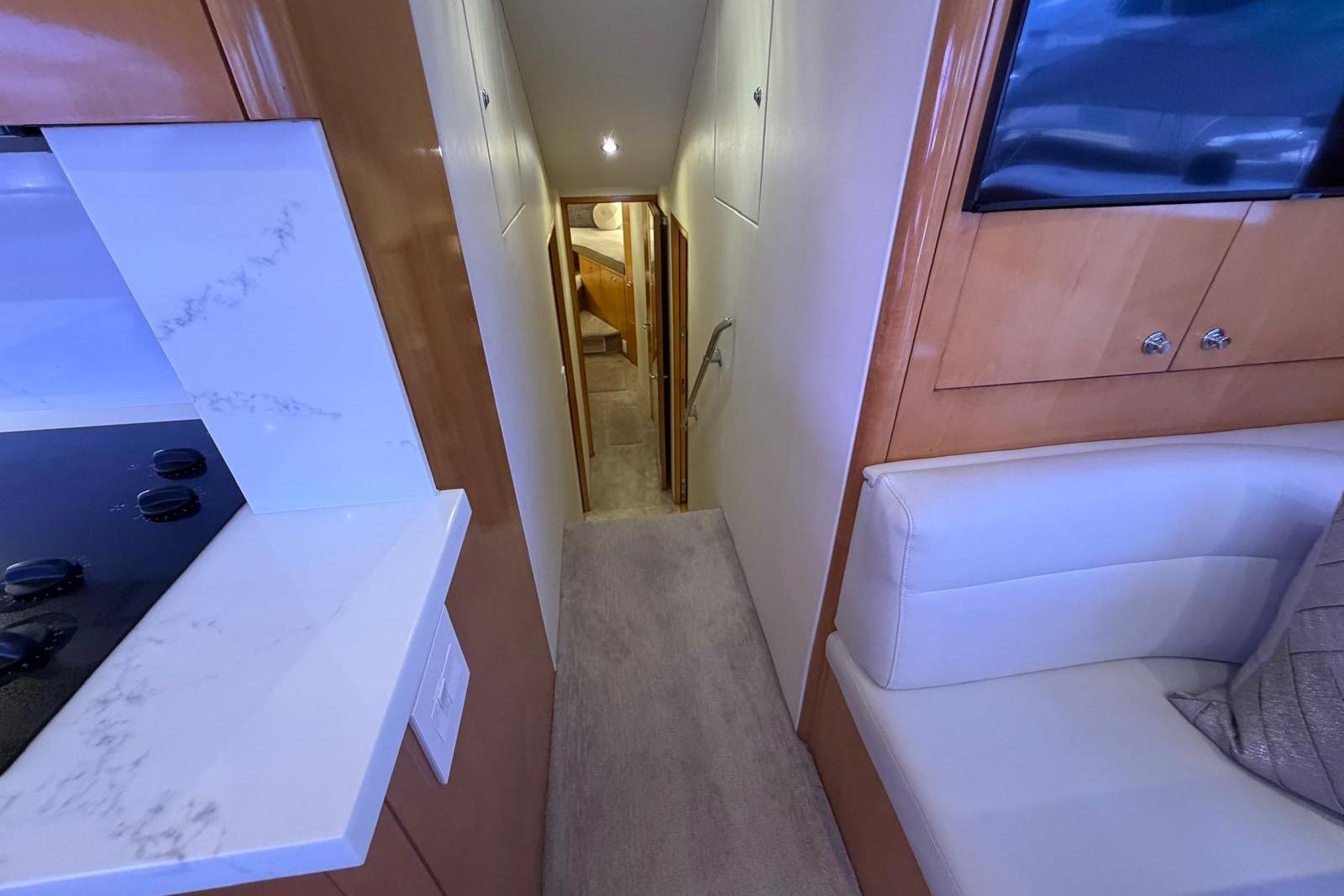 Interior view of 2003 Hatteras 54 Convertible yacht, featuring modern design and comfortable seating.