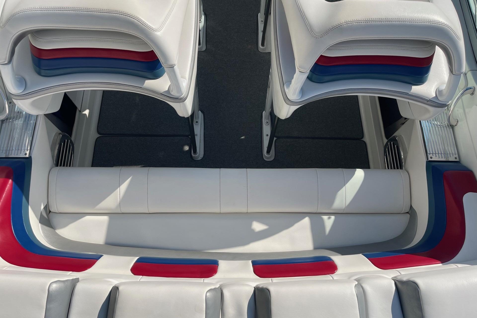 2004 Formula 382 FASTech boat interior with white, red, and blue seating.