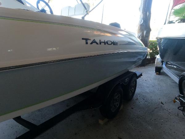 2023 Tahoe 2150 CC boat on trailer in a shaded area.