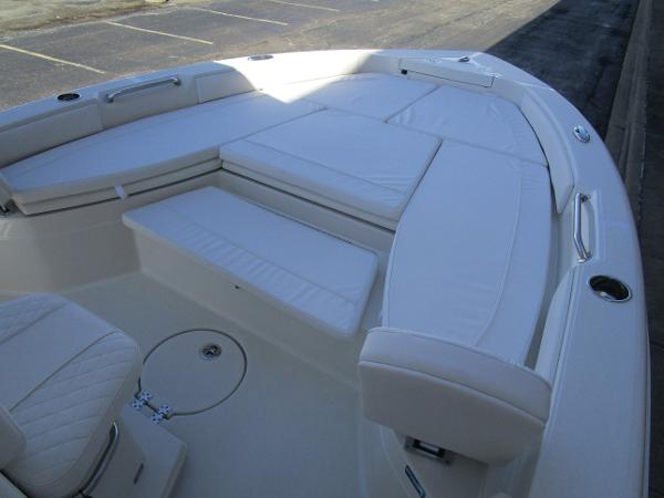 2024 Ranger 2660 Bay boat with spacious seating and white cushions.