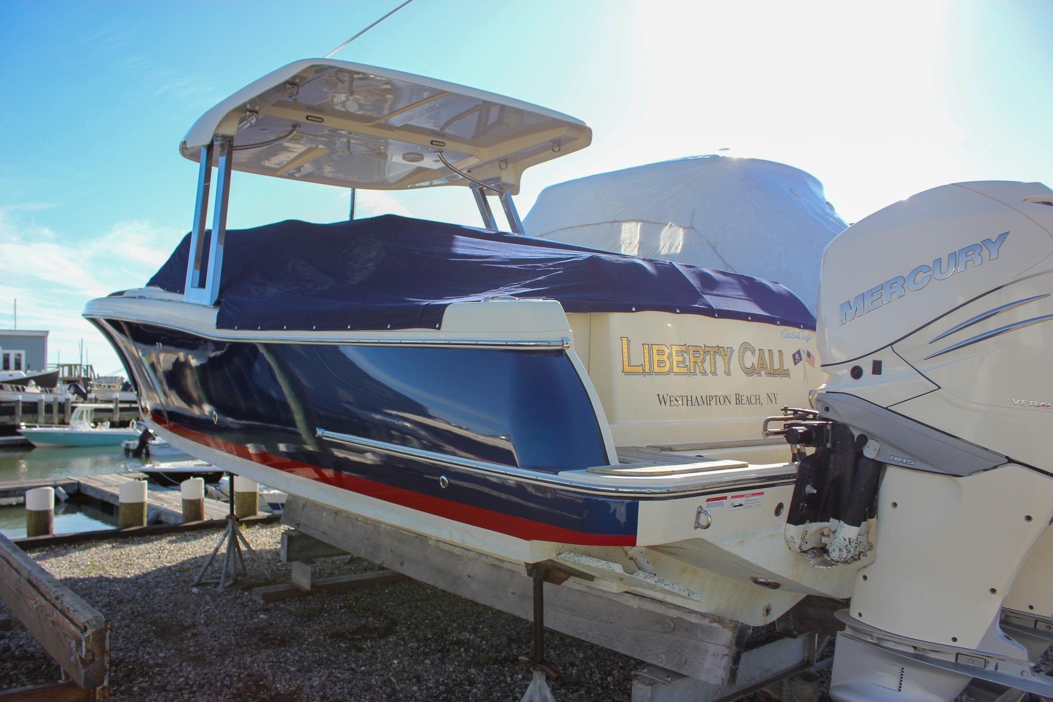 2018 Chris-Craft Calypso 30 boat with Mercury engine, docked at Westhampton Beach.