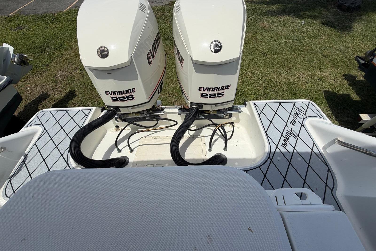 2001 Hydra-Sports Vector 2600 WA with twin Evinrude 225 engines on grass.