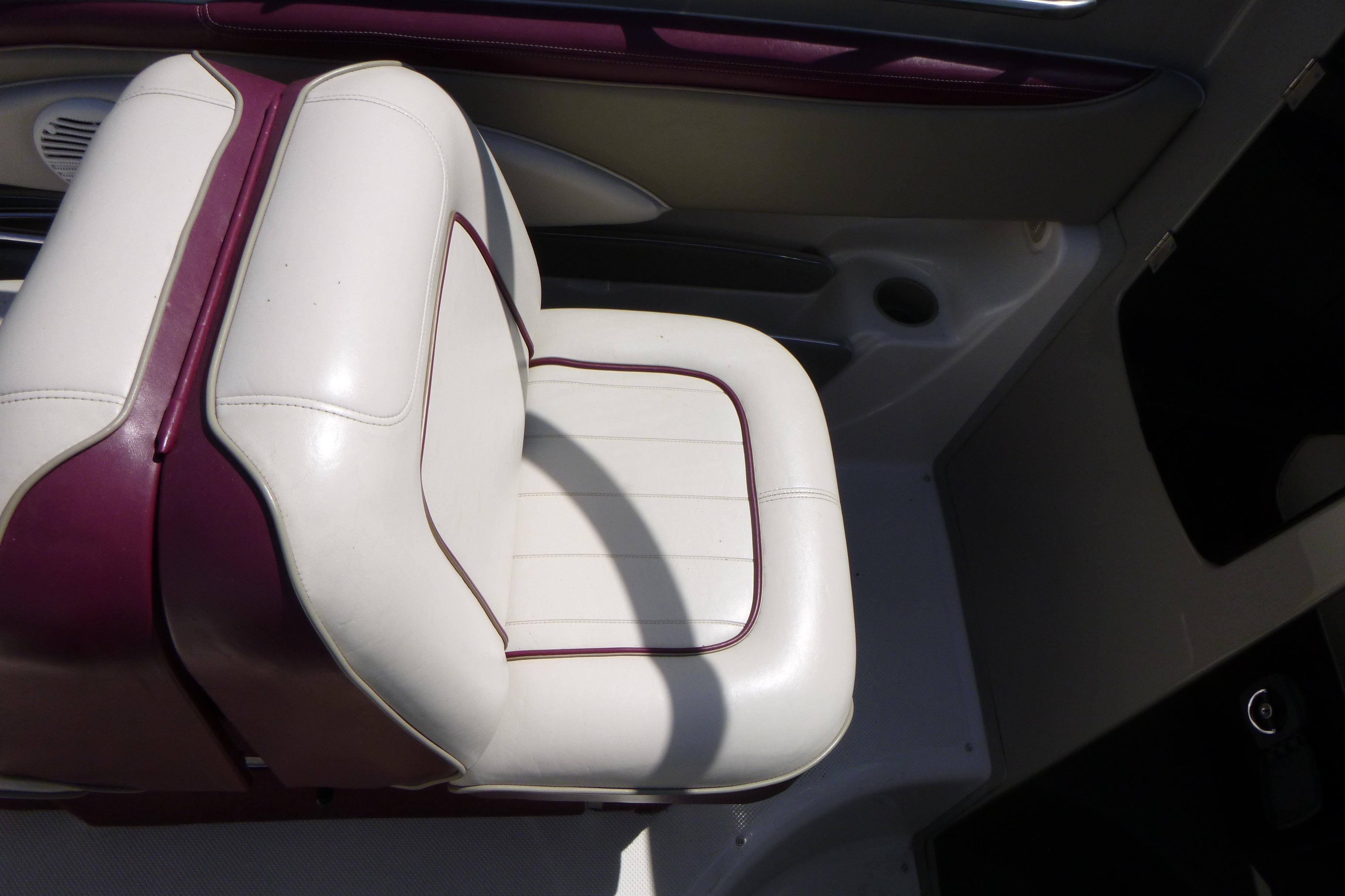 White and maroon seat in 1998 Maxum 2300 SC boat interior.