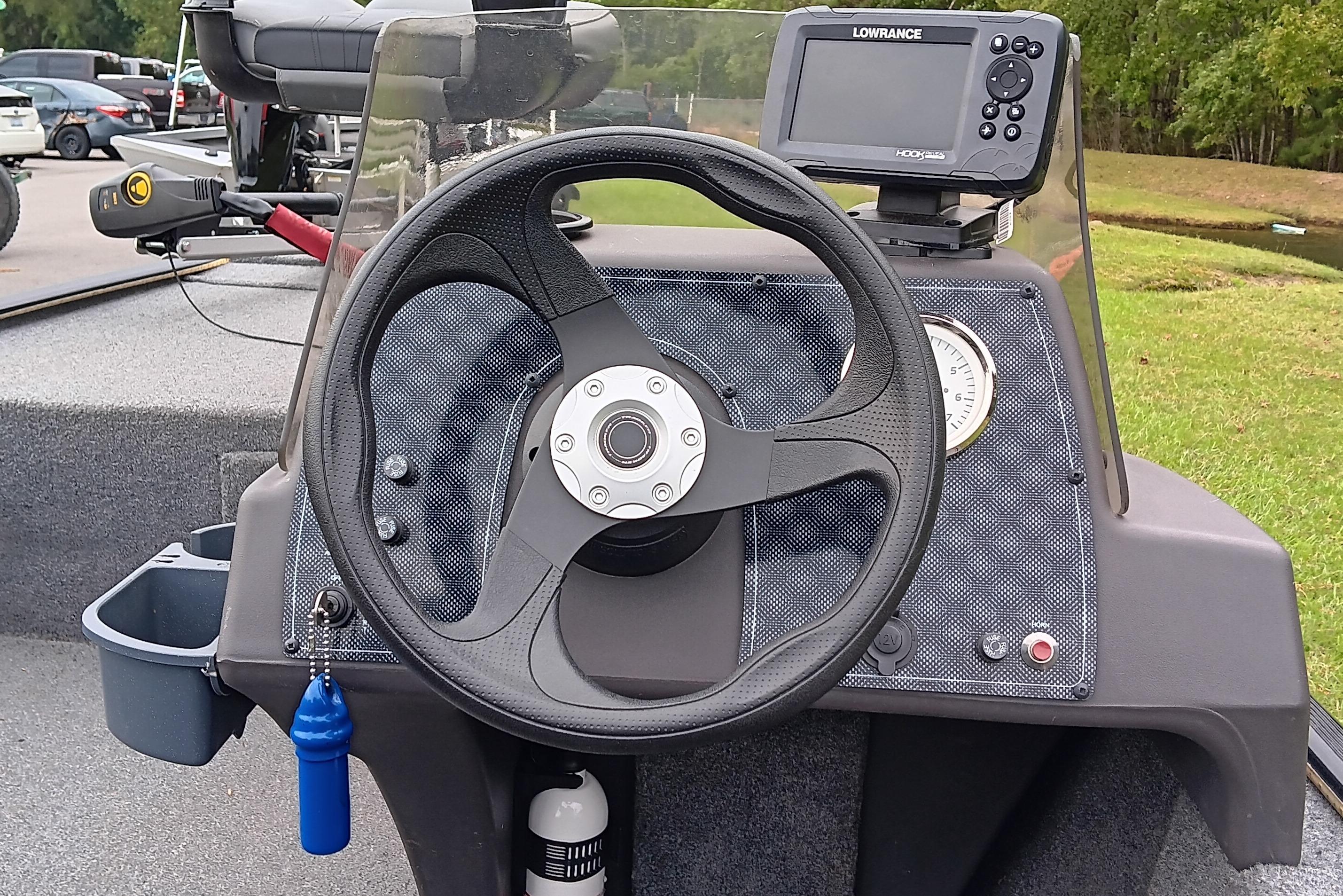 2023 Tracker Bass Tracker Classic XL dashboard with steering wheel and fish finder.