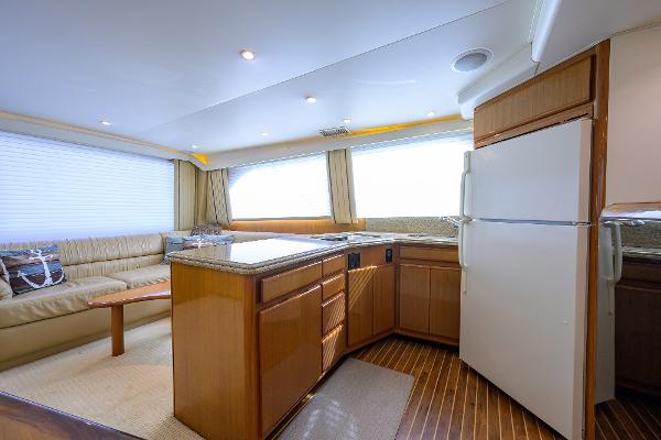 Interior of 2000 Viking 50 Convertible yacht with modern kitchen and seating area.