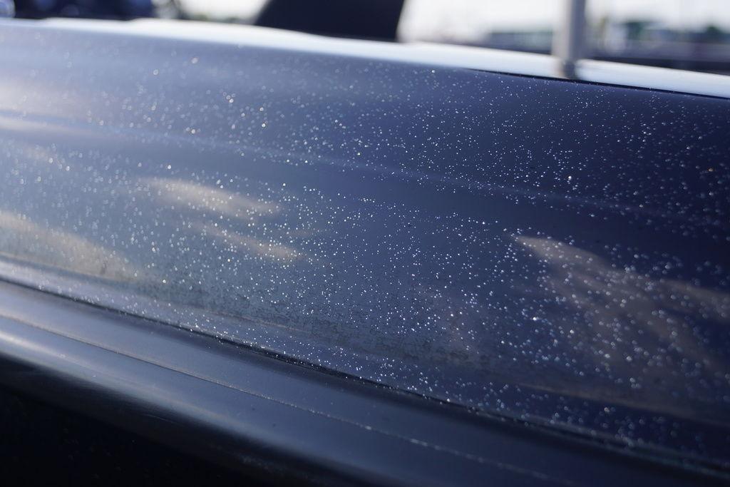 Close-up of 2025 Phoenix 921 Elite's sparkling metallic finish under sunlight.
