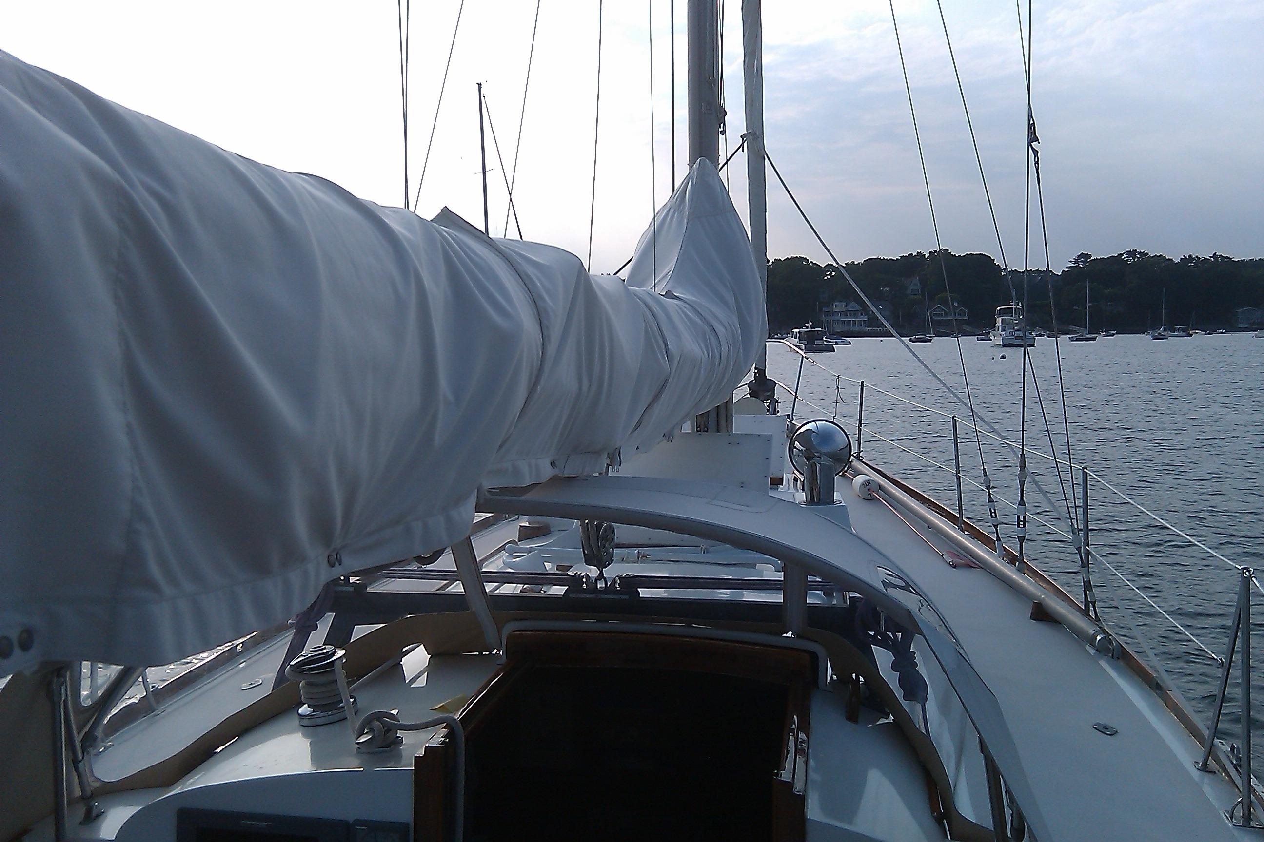 1970 Hinckley Bermuda 40 sailboat deck view, moored in a serene harbor.
