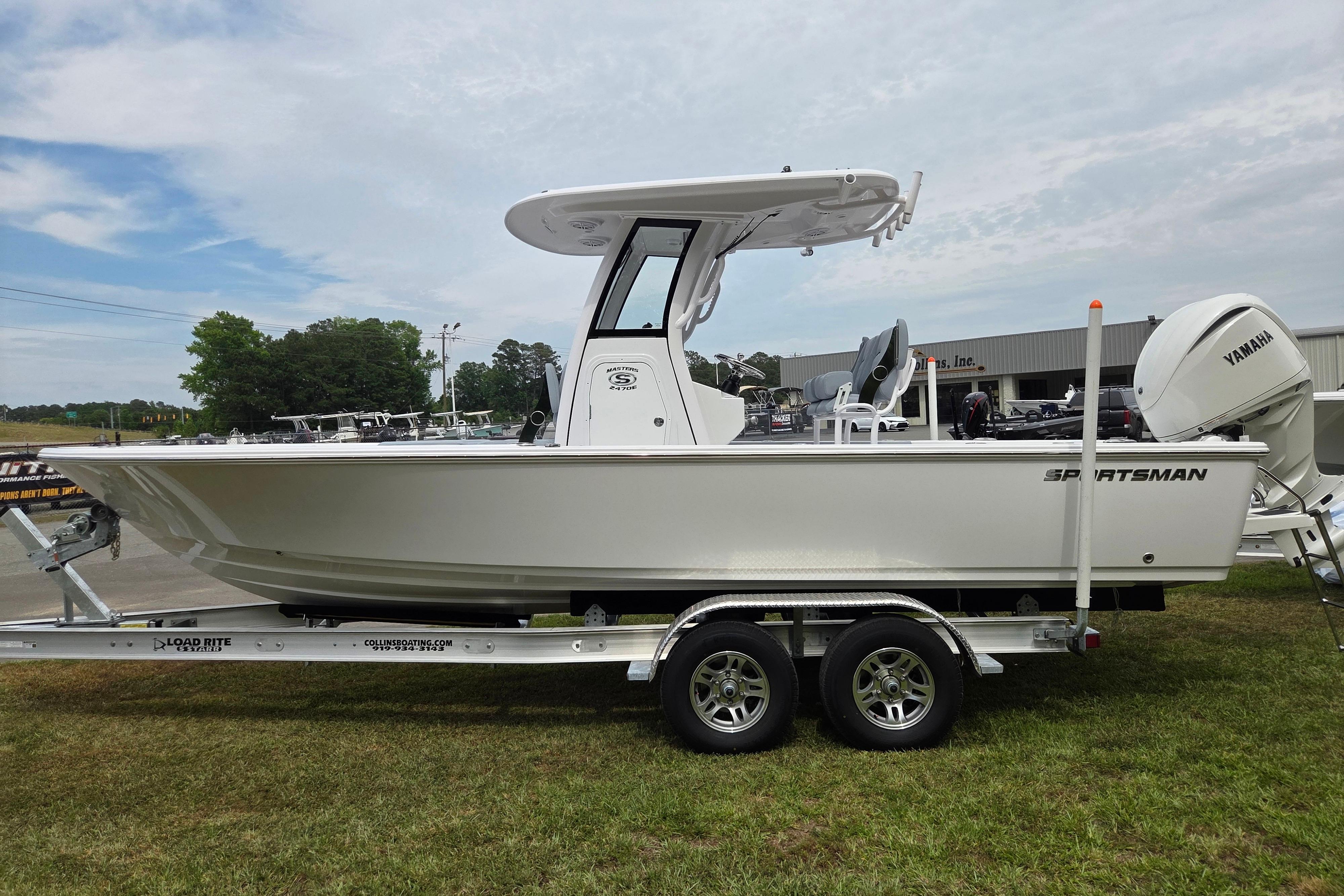 2026 Sportsman Masters 247OE Bay Boat on trailer, side view, outdoors.