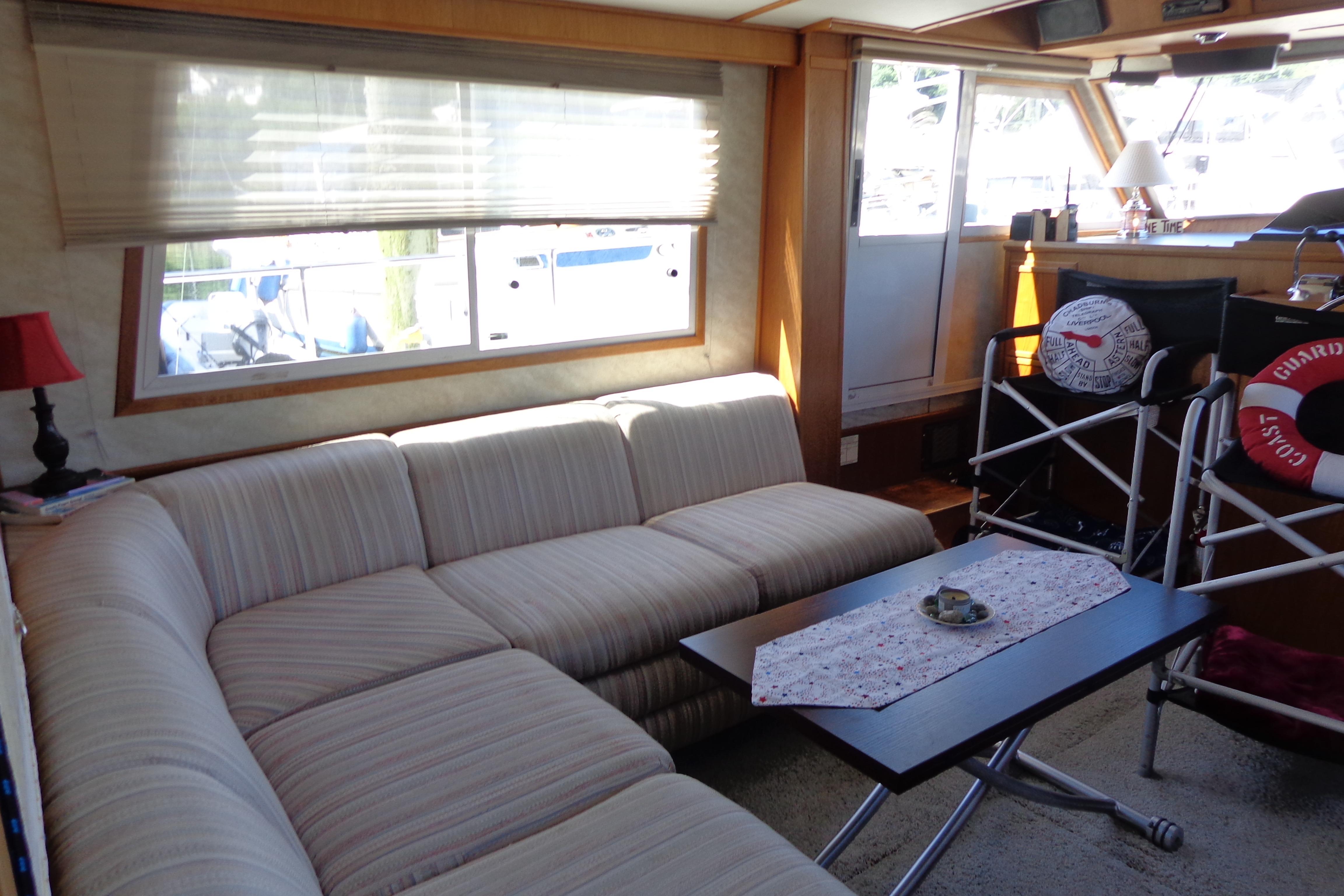 Interior of 1992 Cruise-A-Home Corsair 4200 with cozy seating and nautical decor.