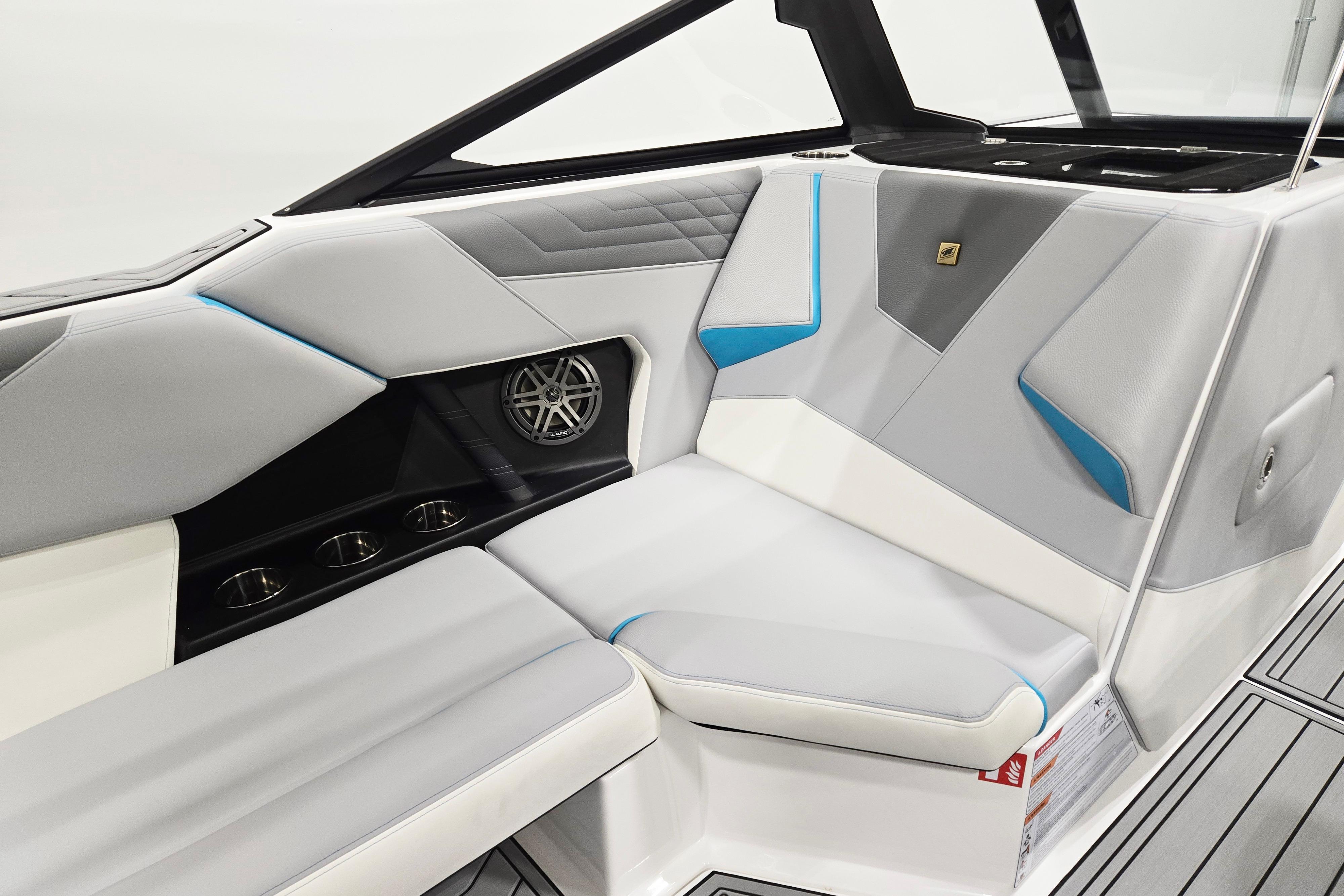 2026 Nautique Super Air Nautique S21 interior with sleek gray and blue seating design.