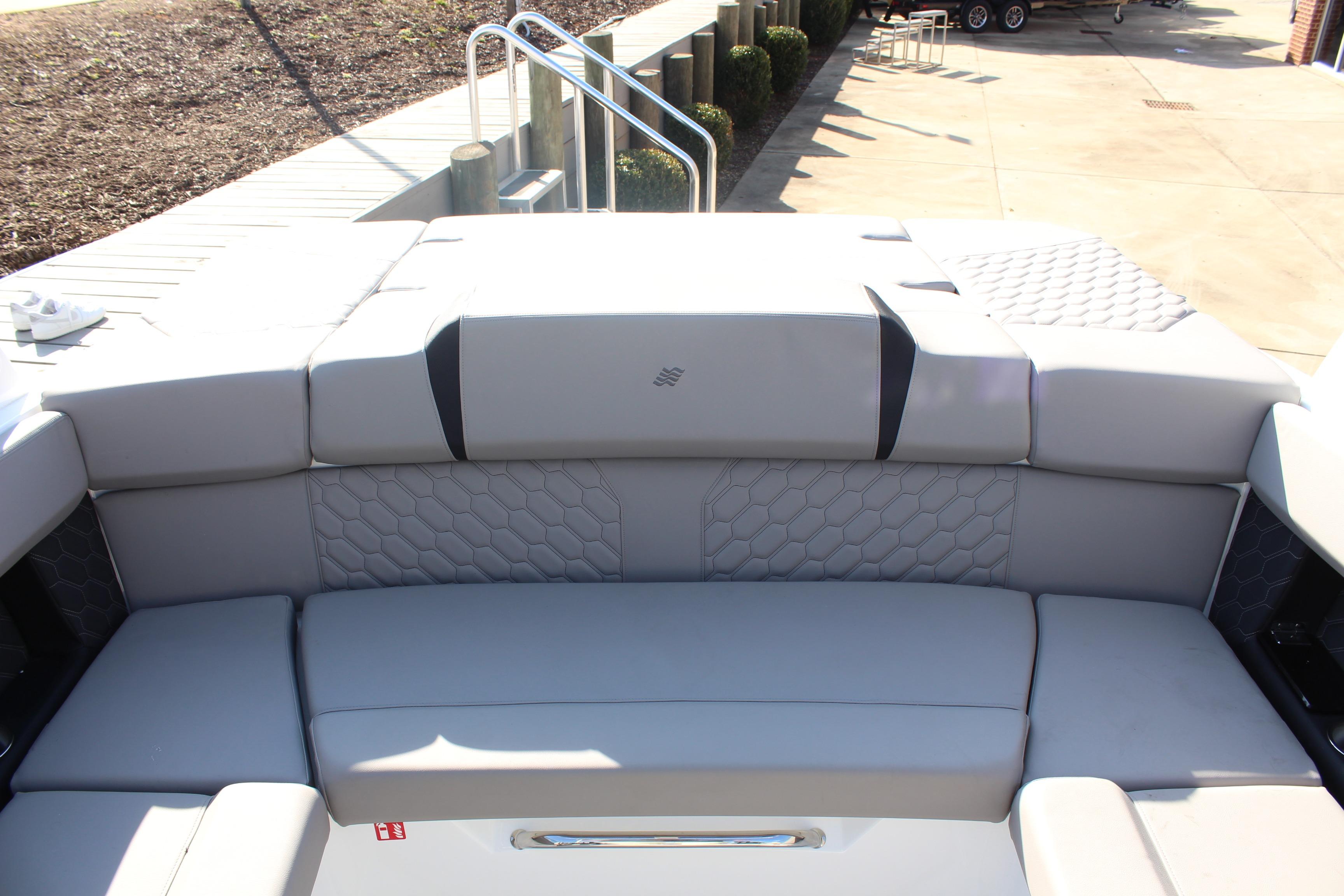 2026 Four Winns H4 boat interior with luxurious gray seating and modern design.
