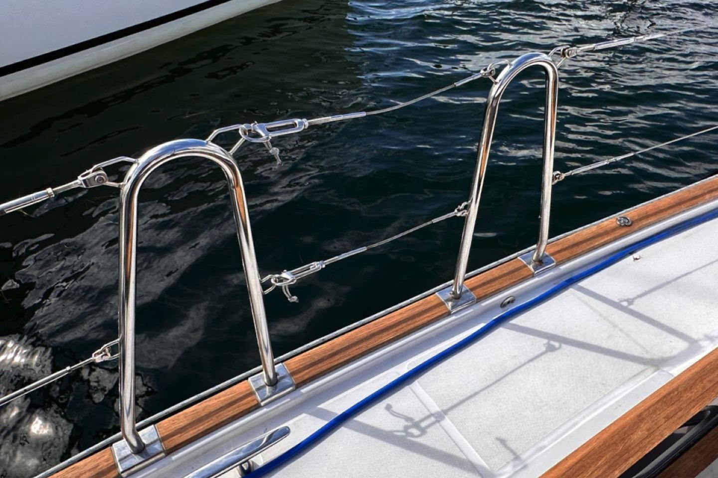 Stainless steel railing on 2021 Wauquiez Pilot Saloon 48 yacht deck by the water.