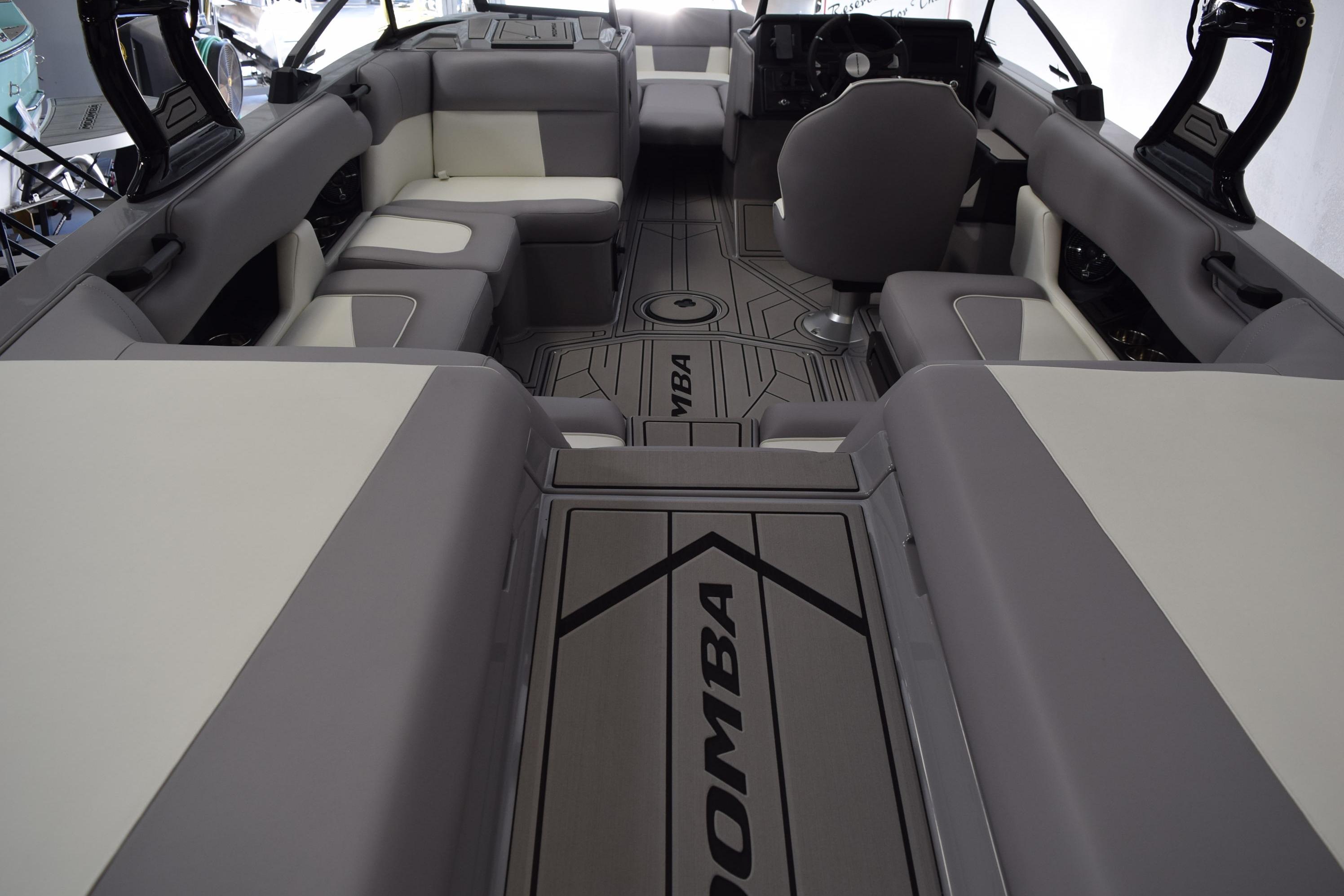 2026 Moomba Craz boat interior with gray and white seating, modern design, and spacious layout.