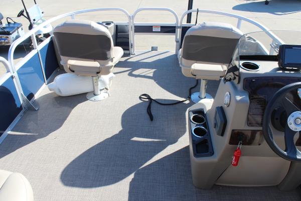 2024 Sun Tracker BB18 boat interior with seating and steering console.
