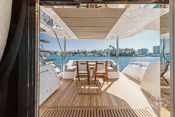 Luxurious 2025 Sunseeker Manhattan 68 yacht with spacious deck and stunning waterfront view.