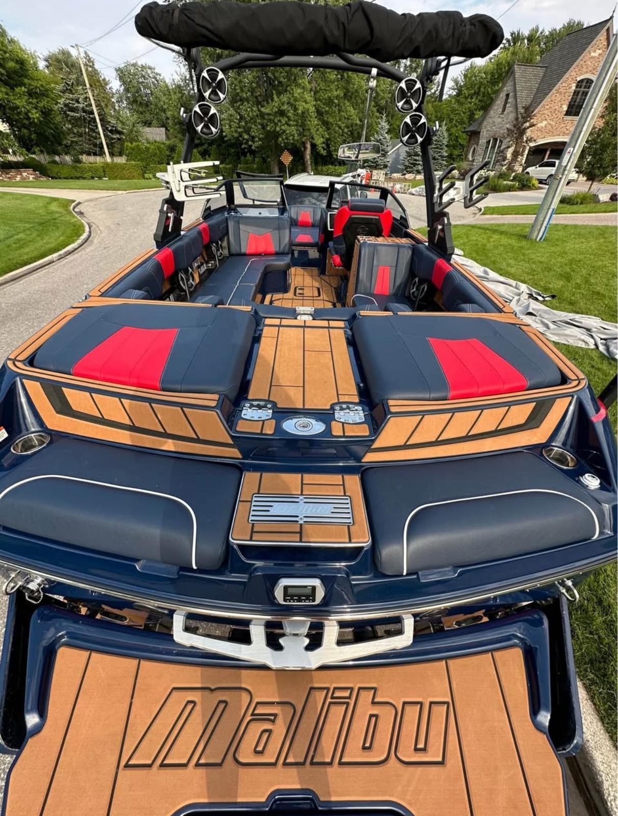 2021 Malibu Wakesetter 24 MXZ boat with luxurious seating and sleek design.