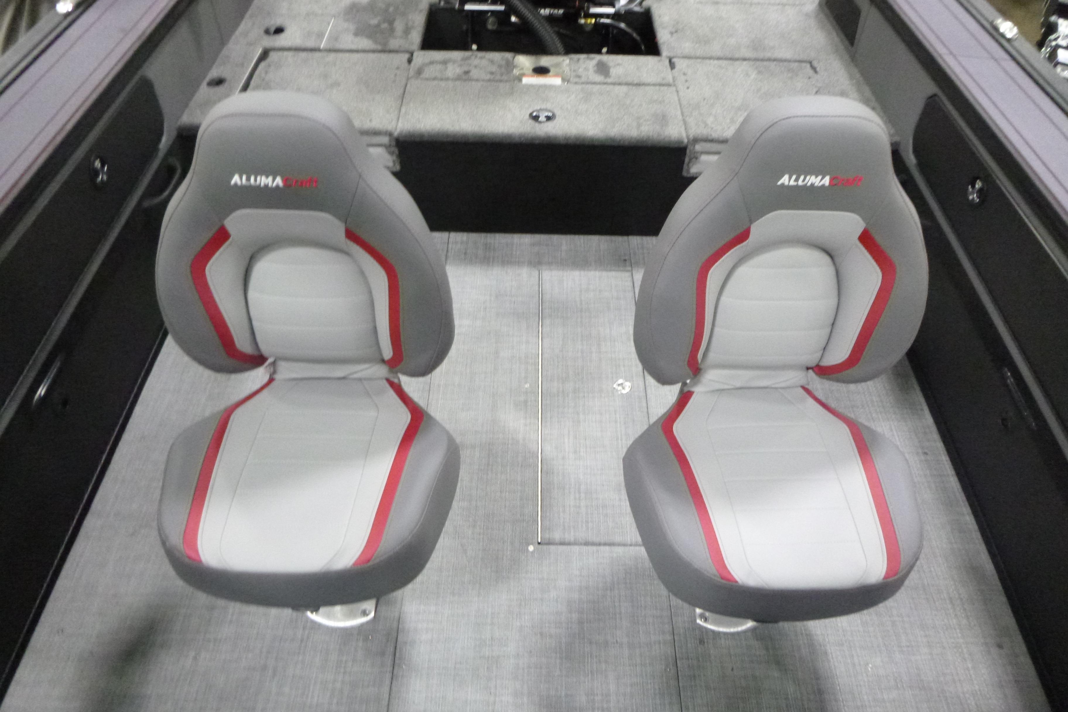 2026 Alumacraft Trophy 205X Sport boat interior with two gray and red seats.