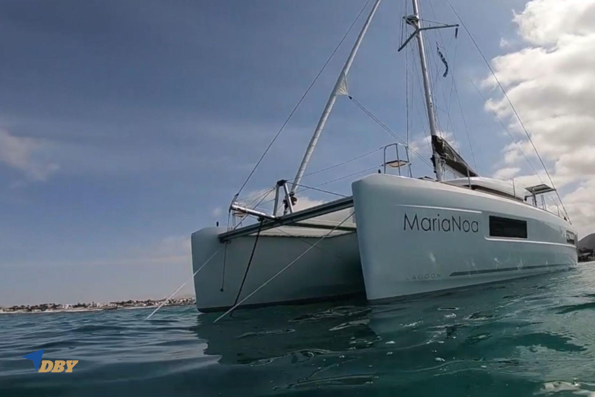 2021 Lagoon 40 catamaran "MariaNoa" sailing on calm waters under a clear sky.