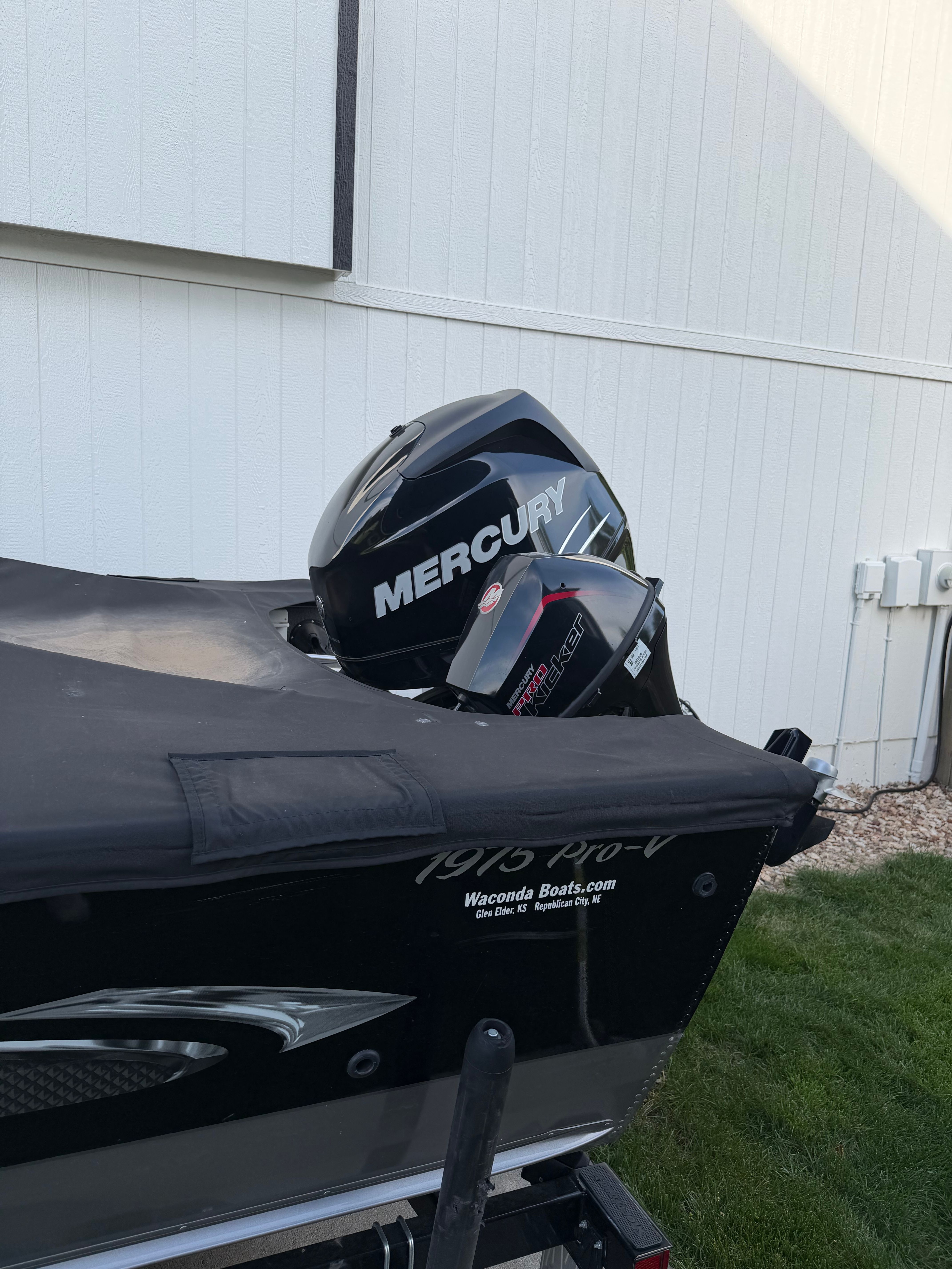 2017 Lund Pro V 1975 boat with Mercury engine, covered.