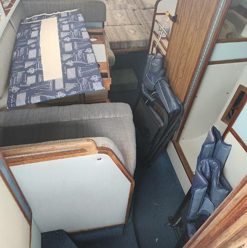 Interior of 1988 Sea Ray 268 DA boat with seating and table setup.