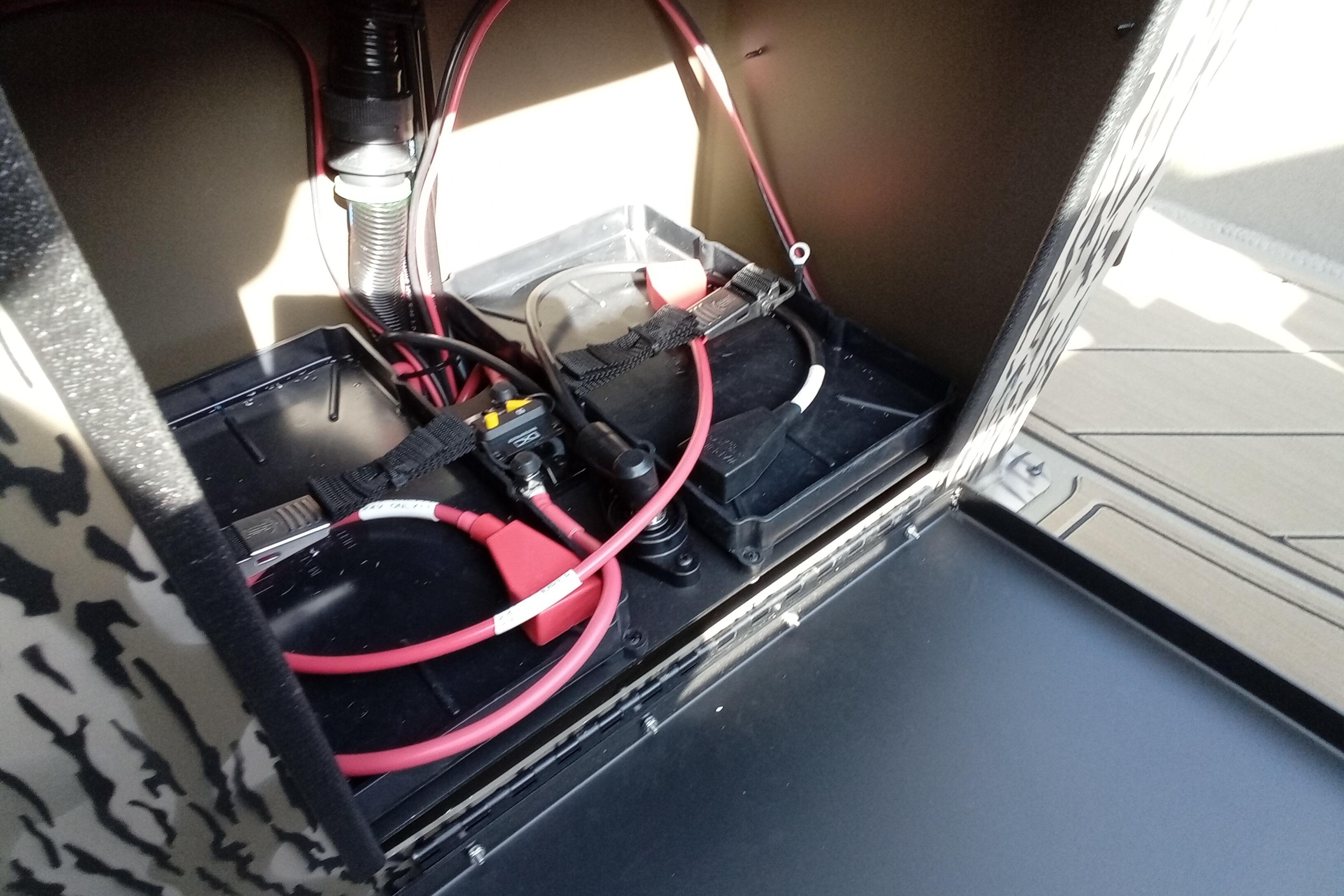 Battery compartment of 2026 Thor 1900 Low Country Elite with wiring and connections.