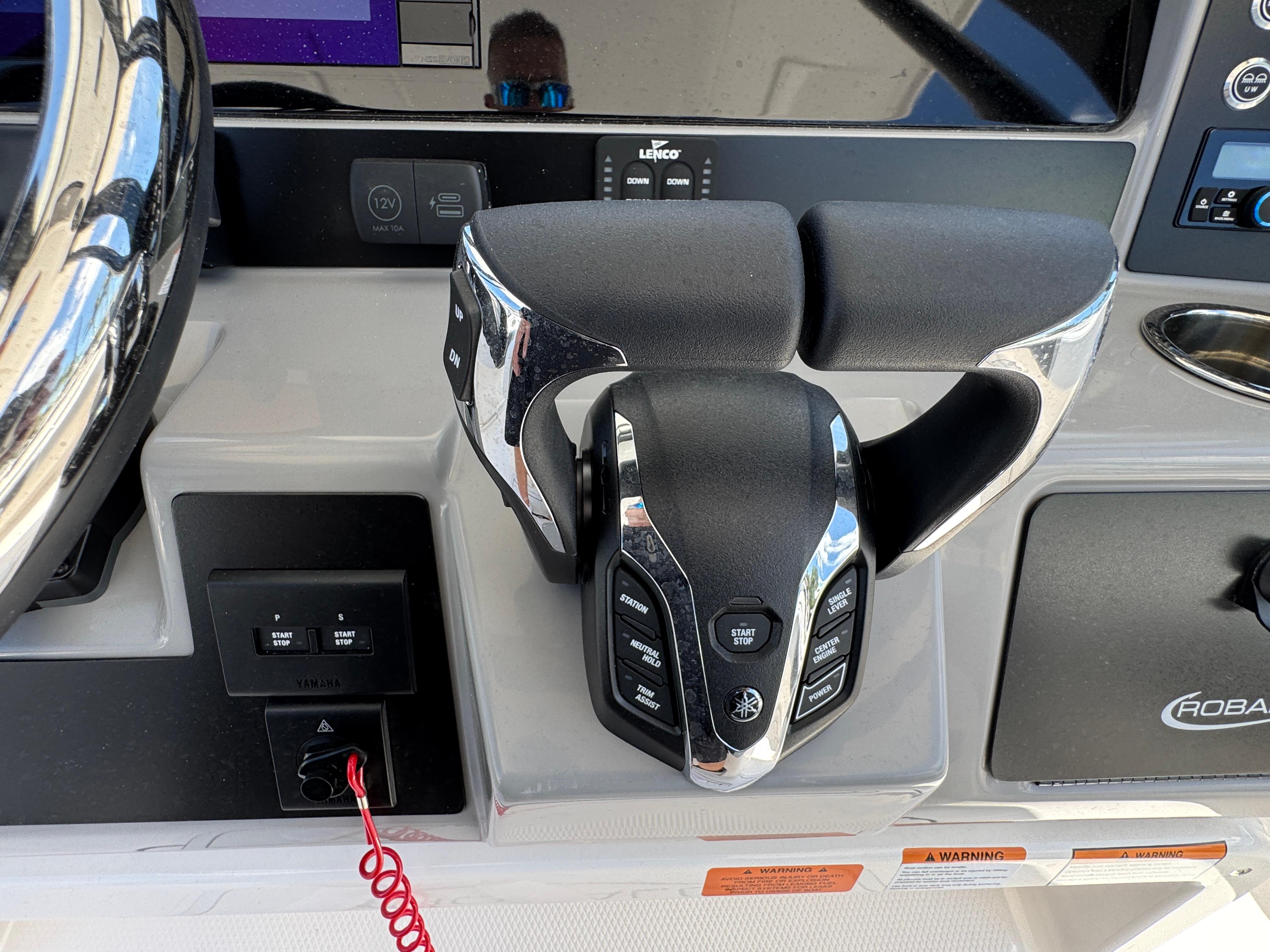 2025 Robalo R270 Center Console boat controls with modern steering and dashboard features.
