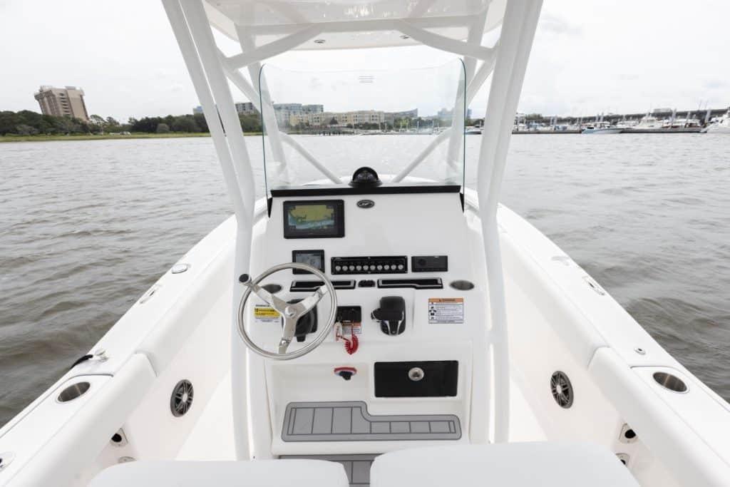 Helm of 2027 Sea Fox 248 Commander boat with steering wheel and control panel.