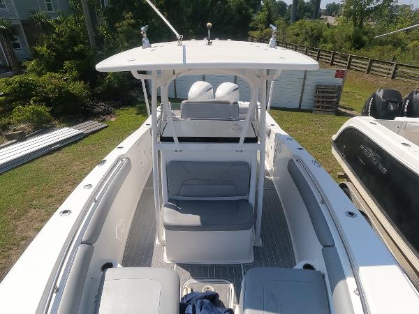 2011 Sea Hunt Gamefish 29 boat with center console and seating.