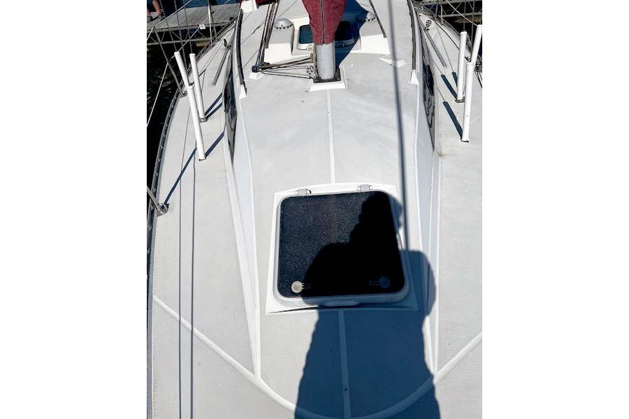 1988 O'Day 322 sailboat deck with hatch and shadow.