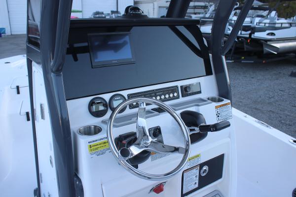 2025 Sea Fox 231 Bay Fox boat dashboard with steering wheel and control panel.