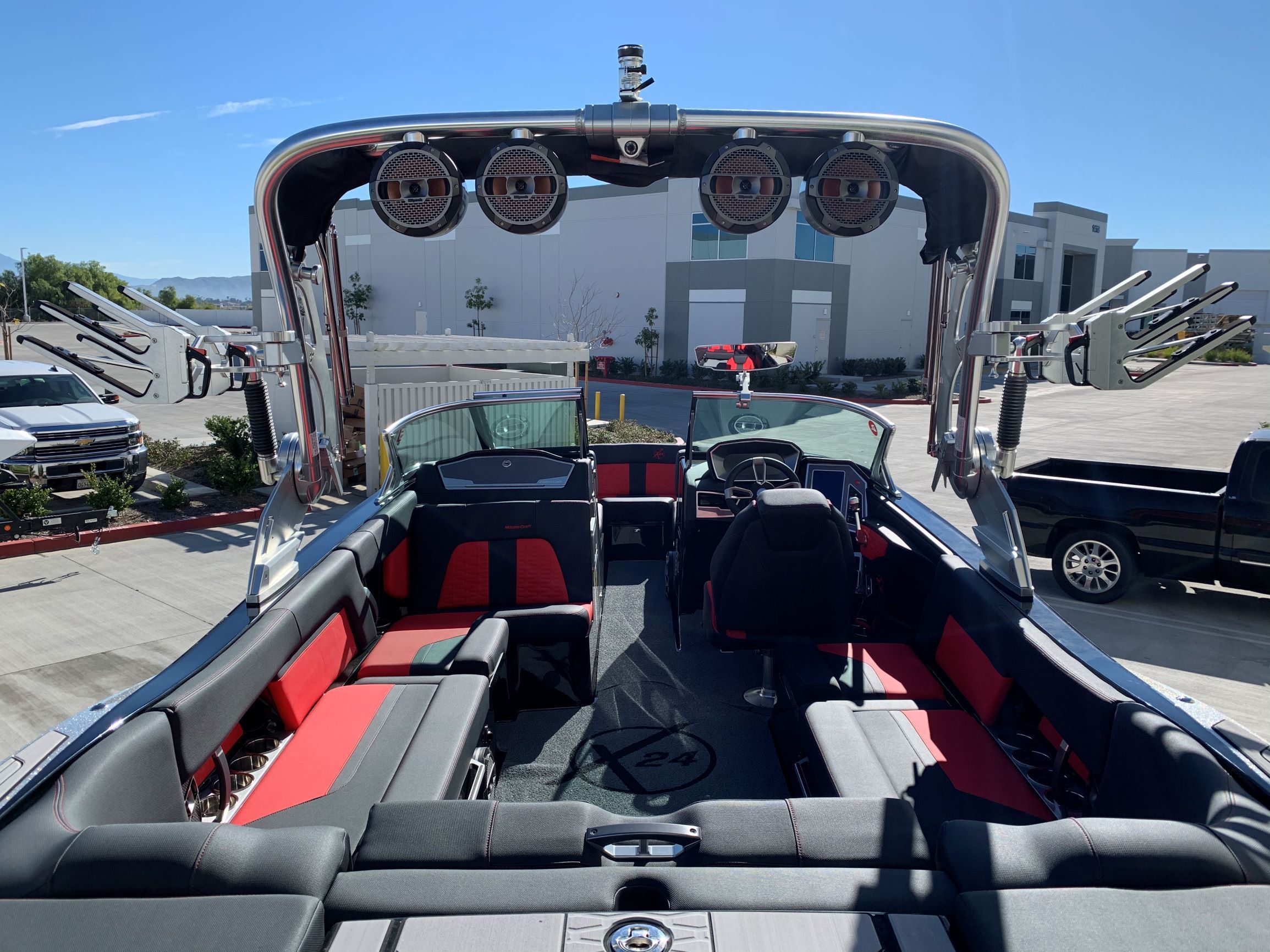 The image shows the interior of a 2020 MasterCraft X24 boat with modern seating and speakers.