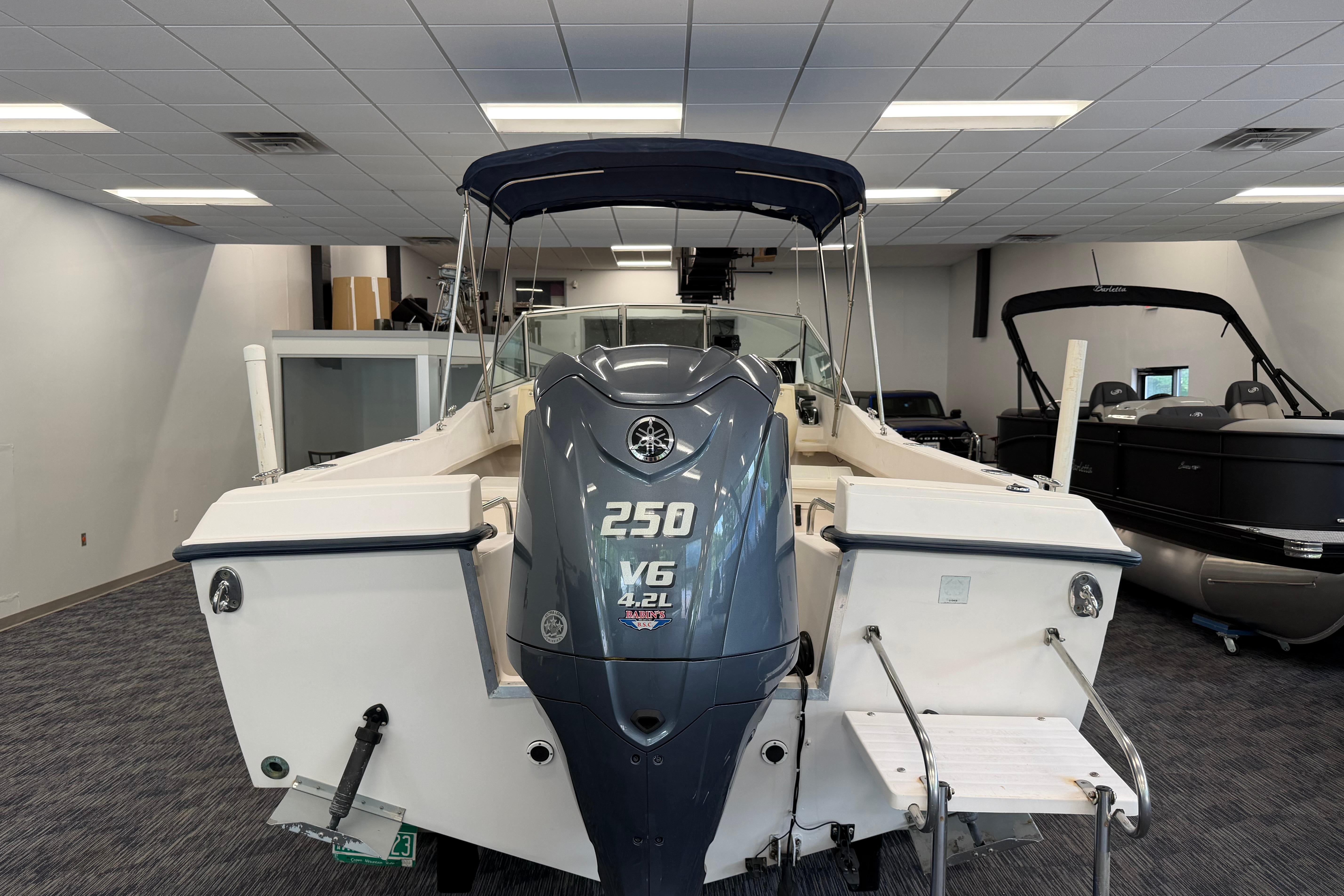 2001 Grady-White Tournament 223 boat with Yamaha 250 V6 engine in showroom.