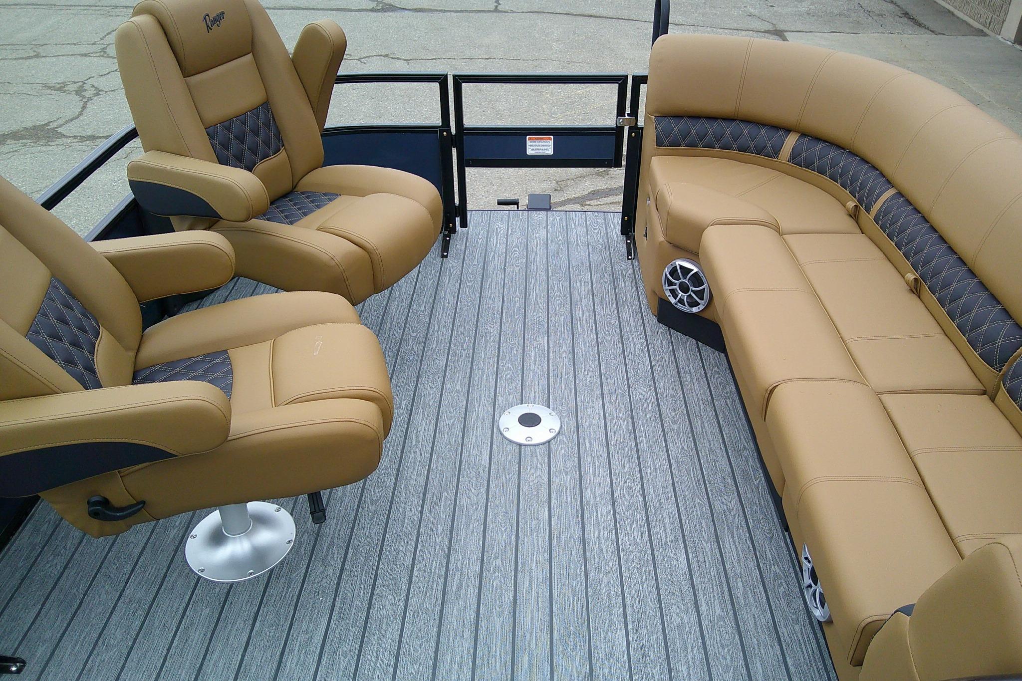 2026 Ranger 220FC boat interior with tan leather seating and gray flooring.