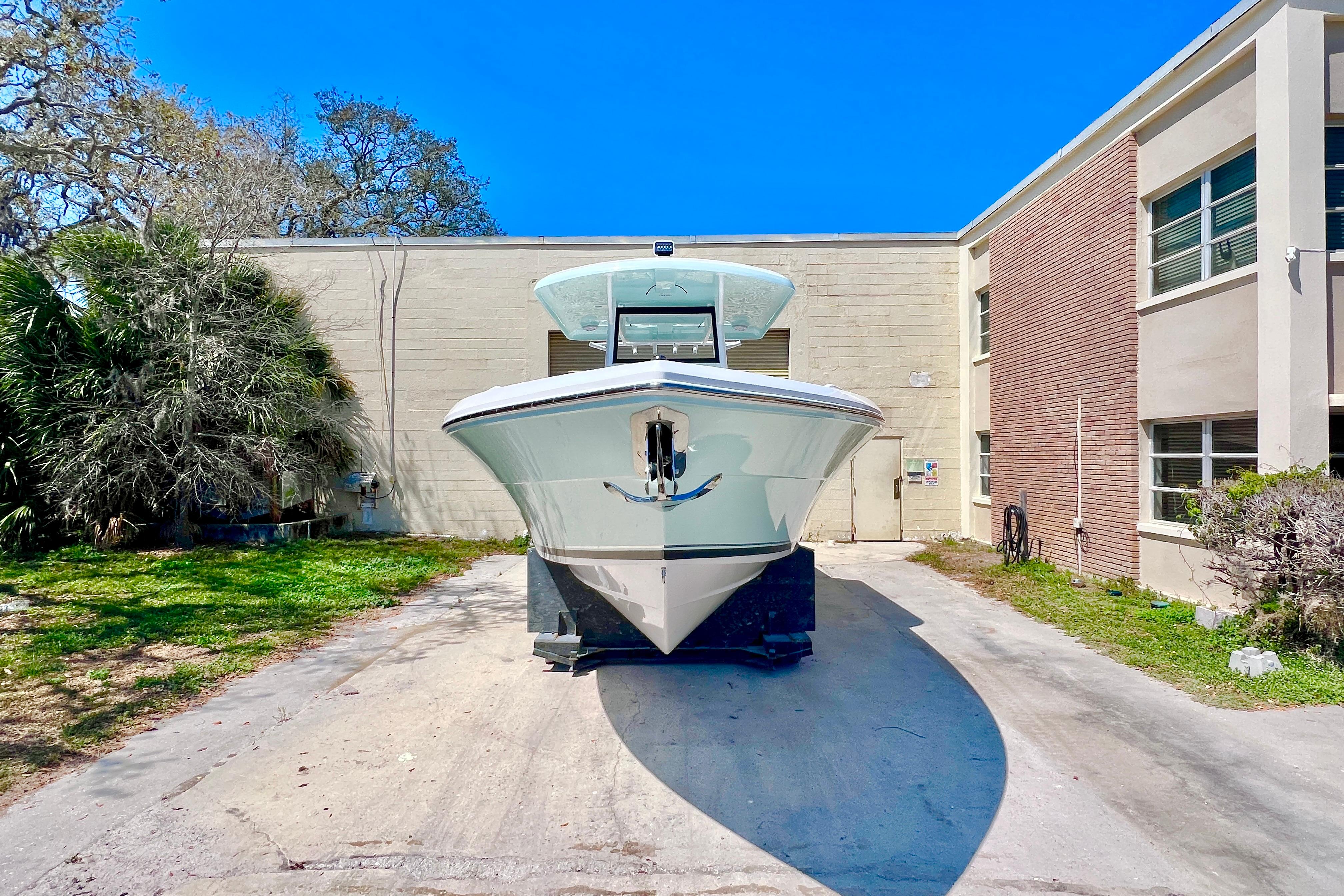 2026 Stamas 31T Aventura boat parked outdoors, front view.
