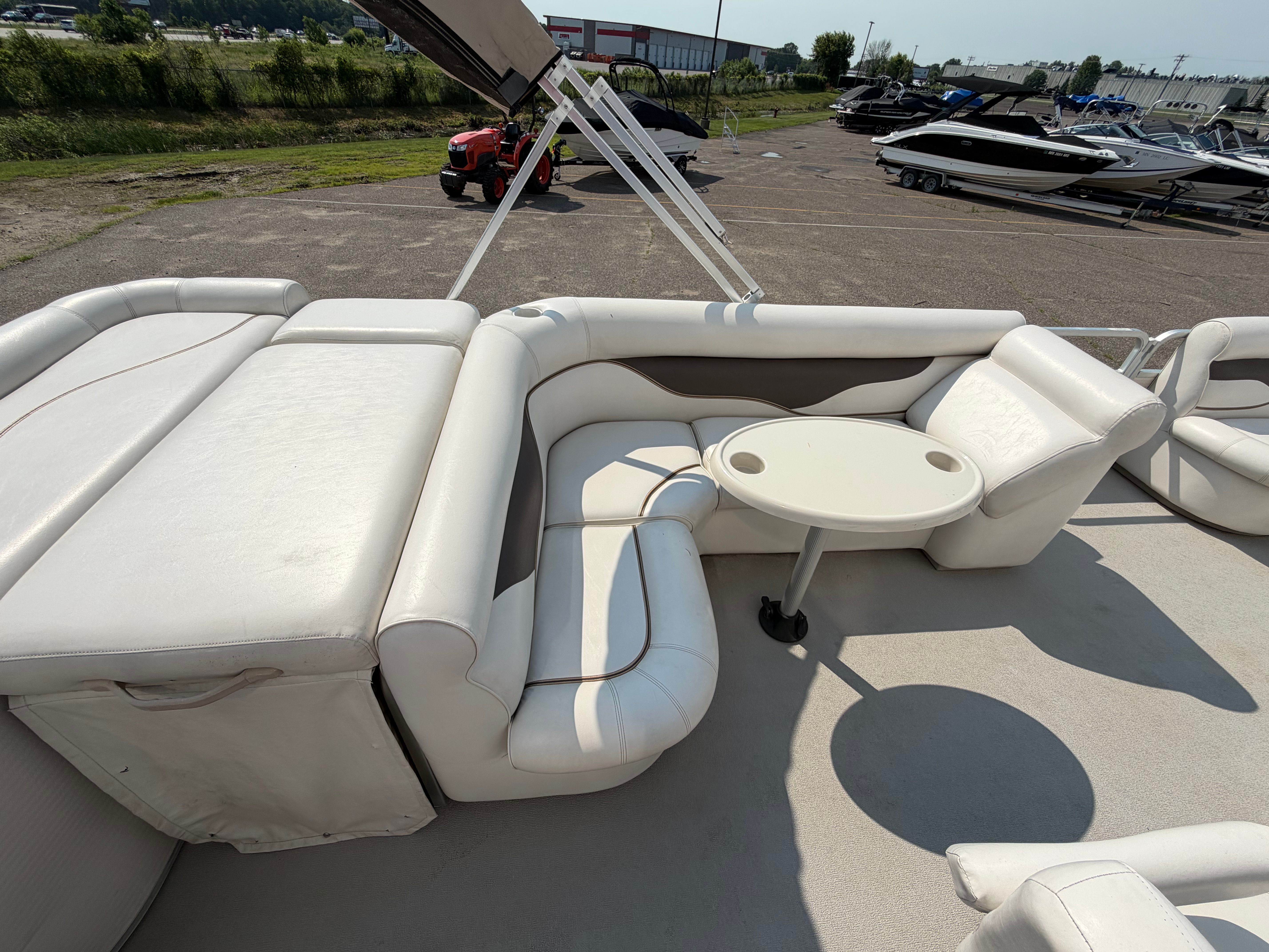 The image shows the white seating area of a 2007 Premier 225 Sunsation pontoon boat.
