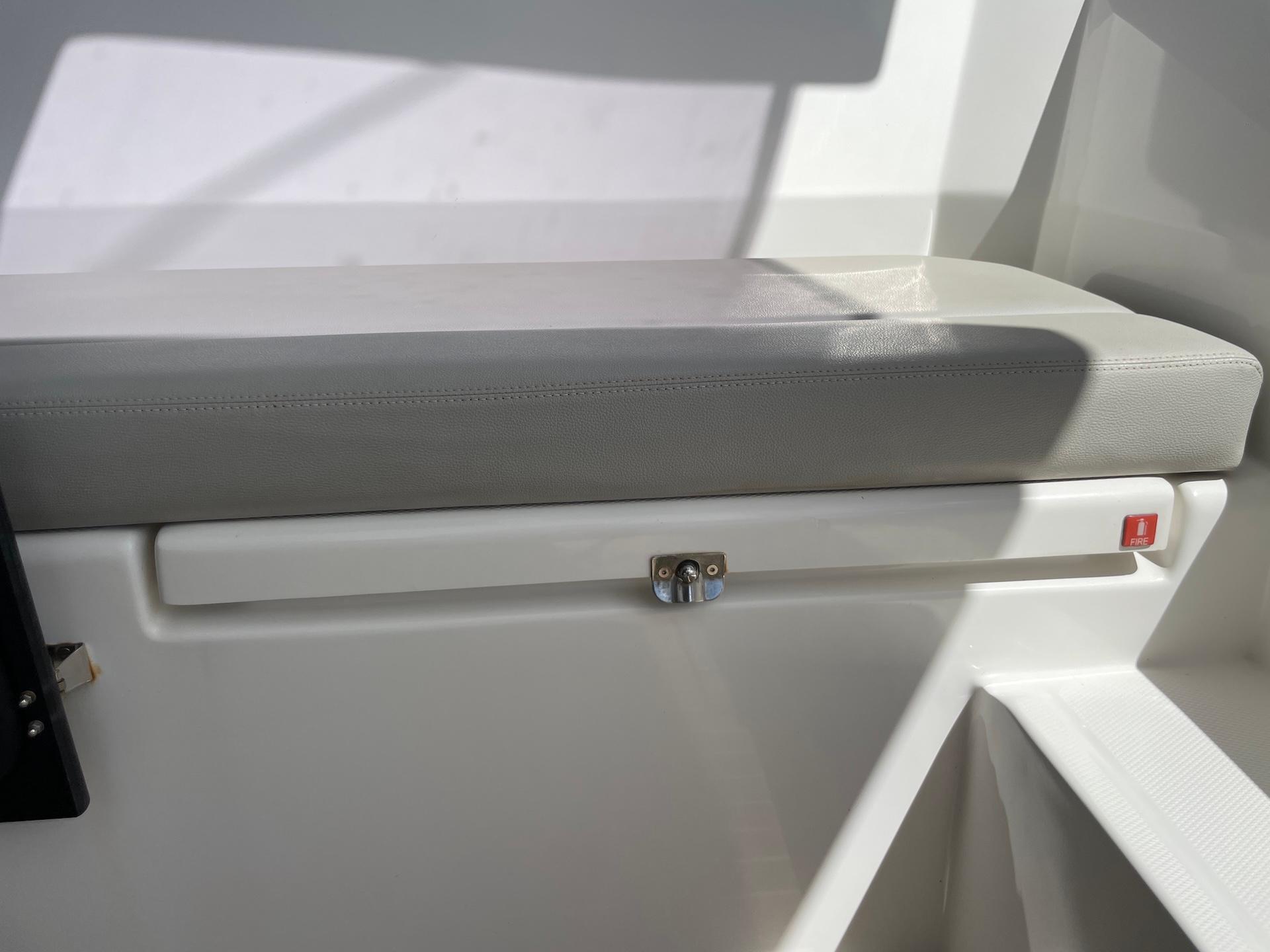 Leopard 45 yacht interior seating area with storage compartment, 2021 model.