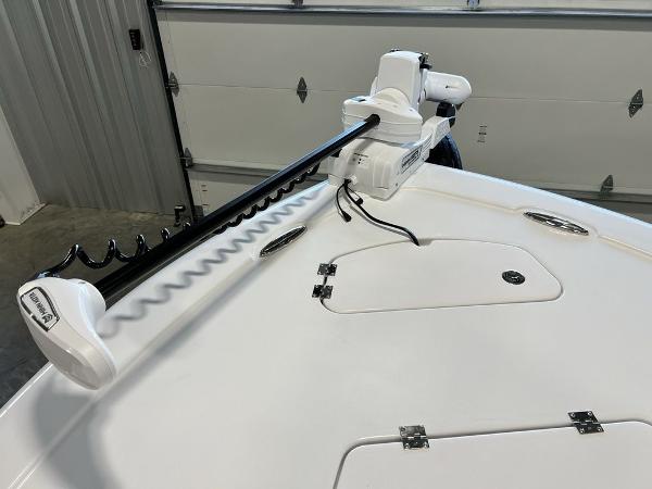 2025 Tidewater 2300 Carolina Bay boat with trolling motor in garage.