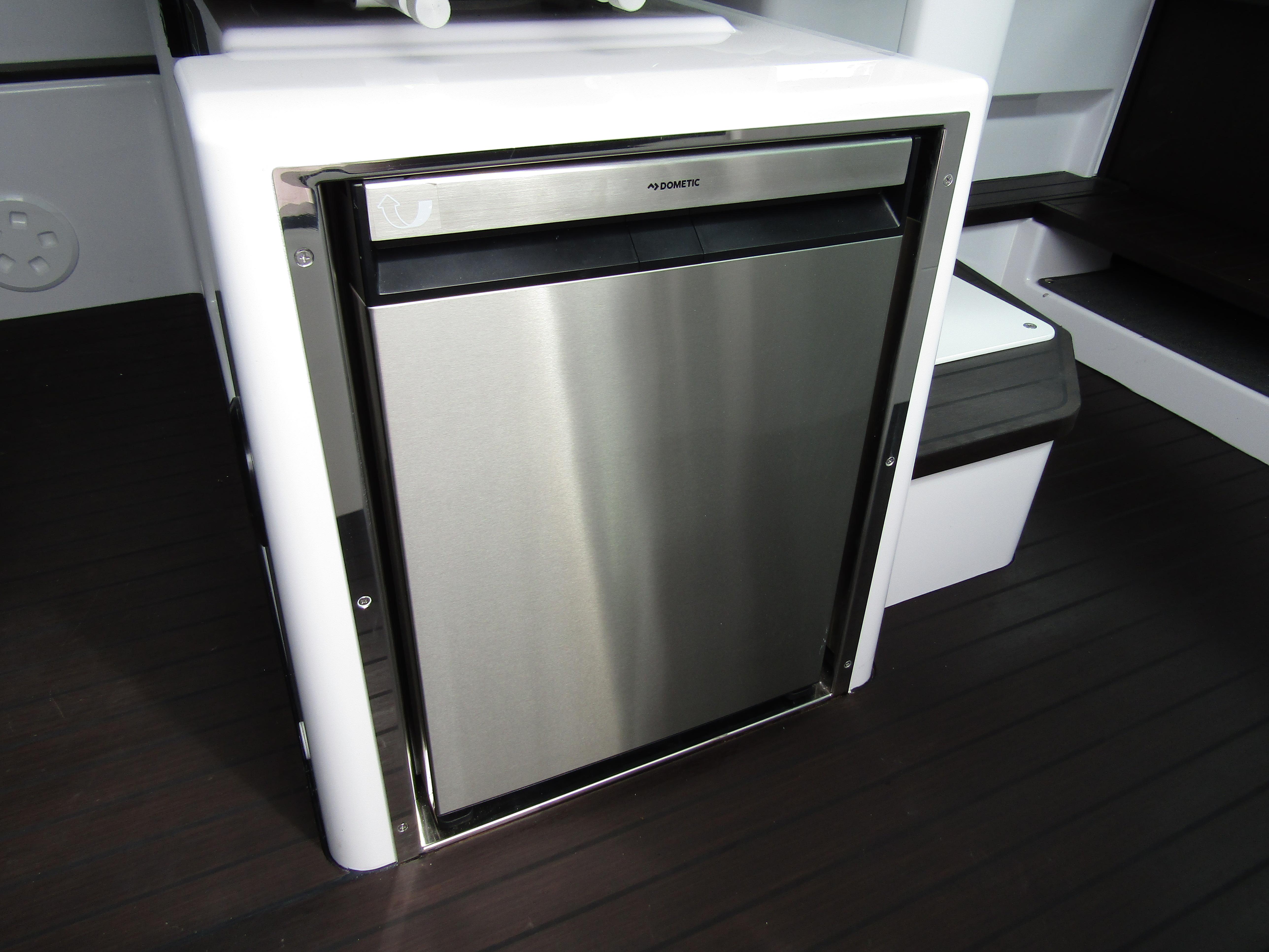 Stainless steel fridge in 2024 Axopar 37XC CROSS CABIN boat interior.