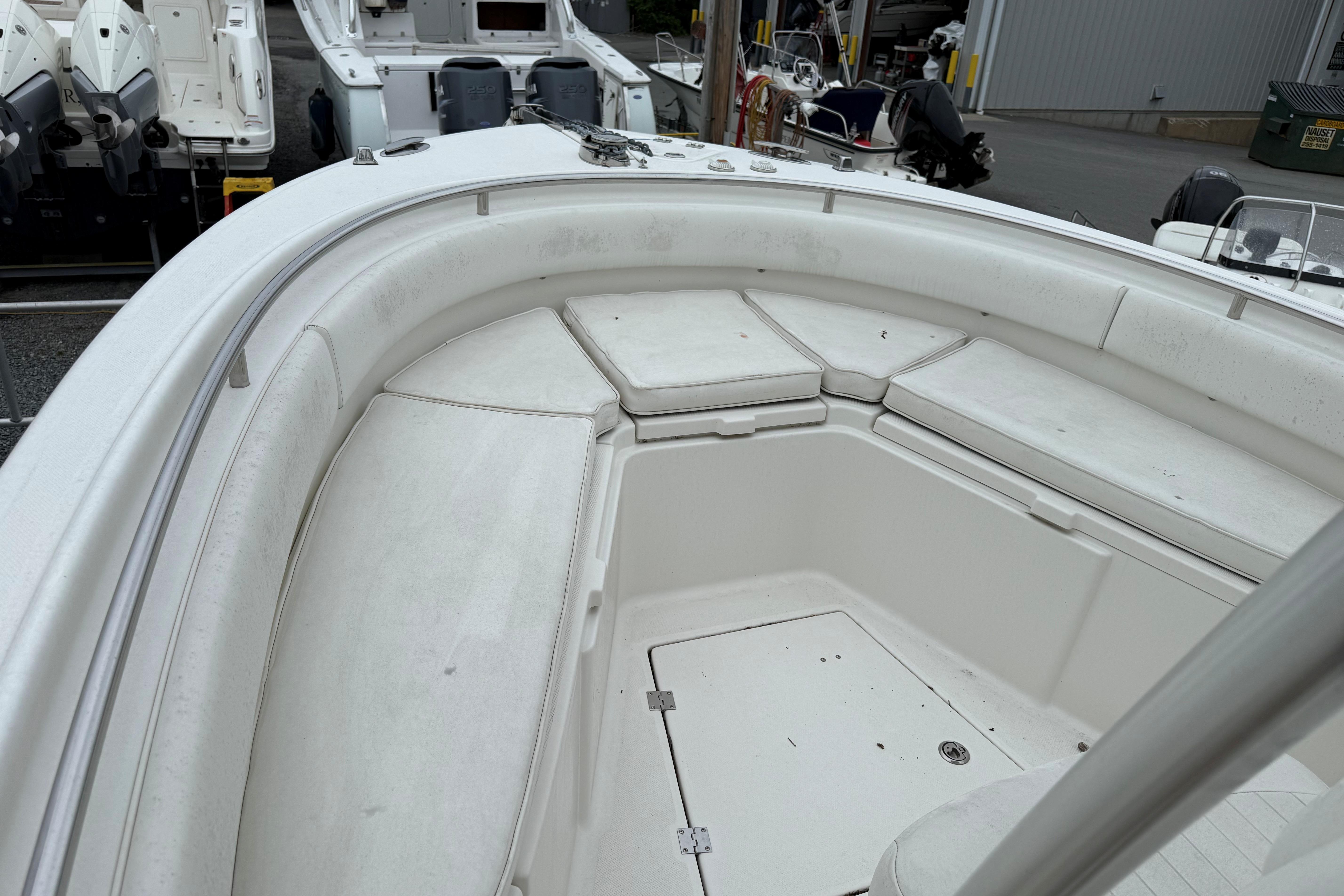 2009 Robalo R240 Center Console boat with spacious seating and storage area.