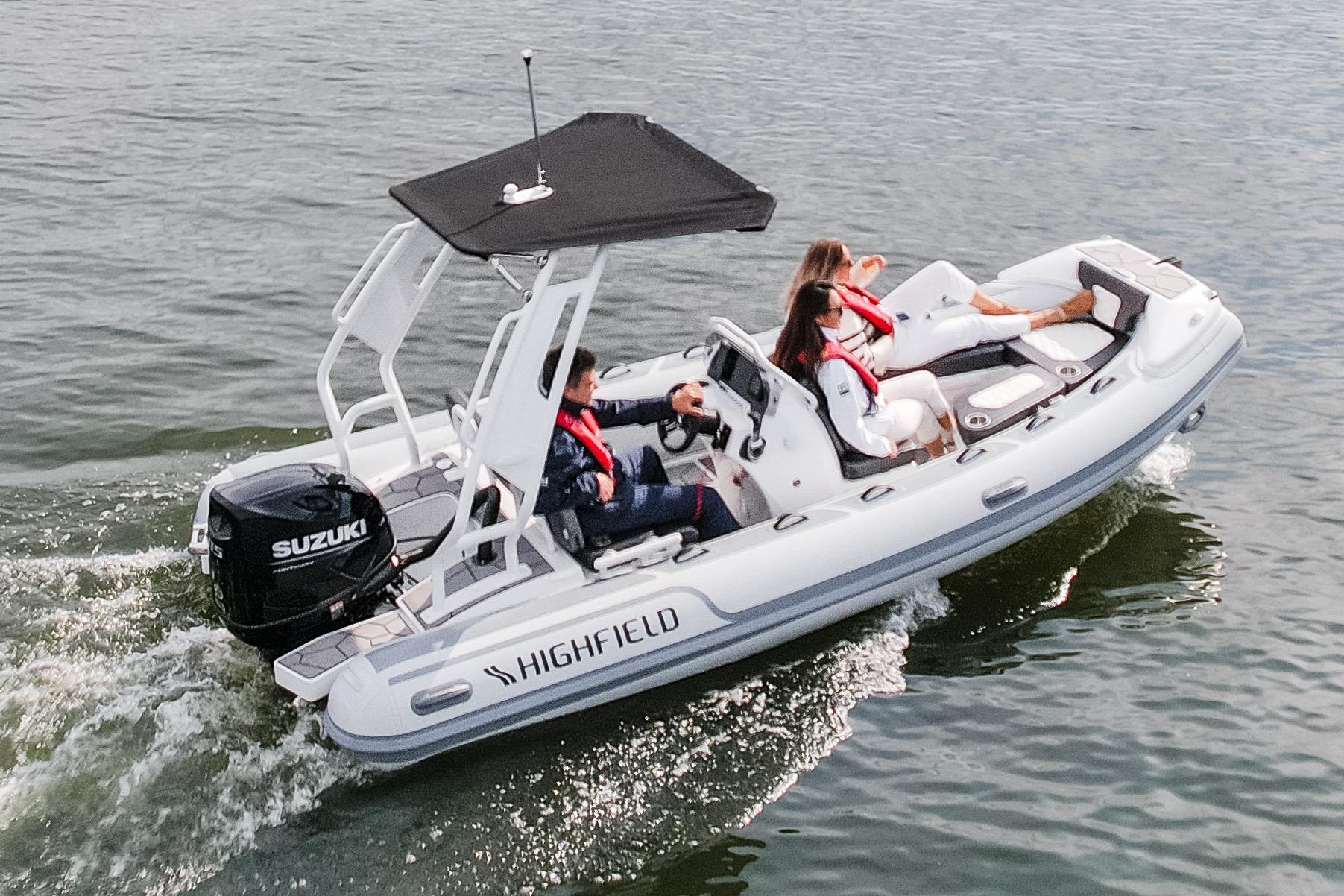 Highfield Sport 520 boat cruising on water, 2026 model with Suzuki engine.