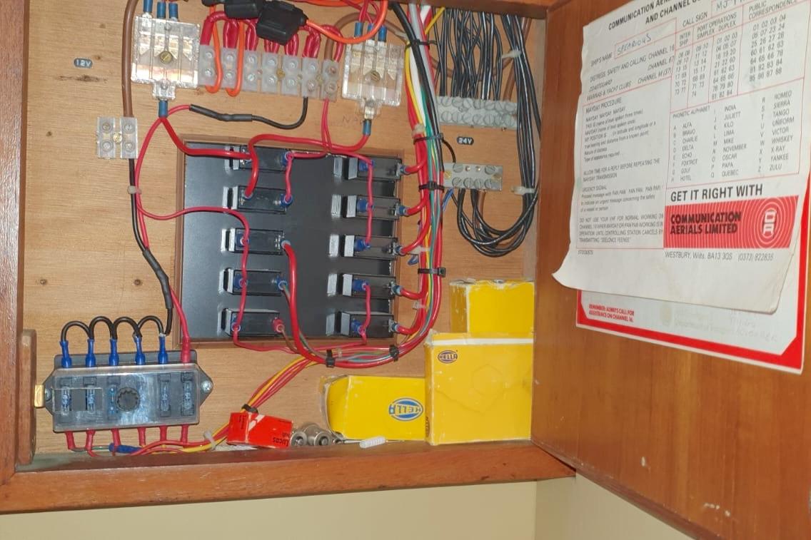 Electrical panel inside Fairey Spearfish MKIII, 1989, with wiring and communication instructions.