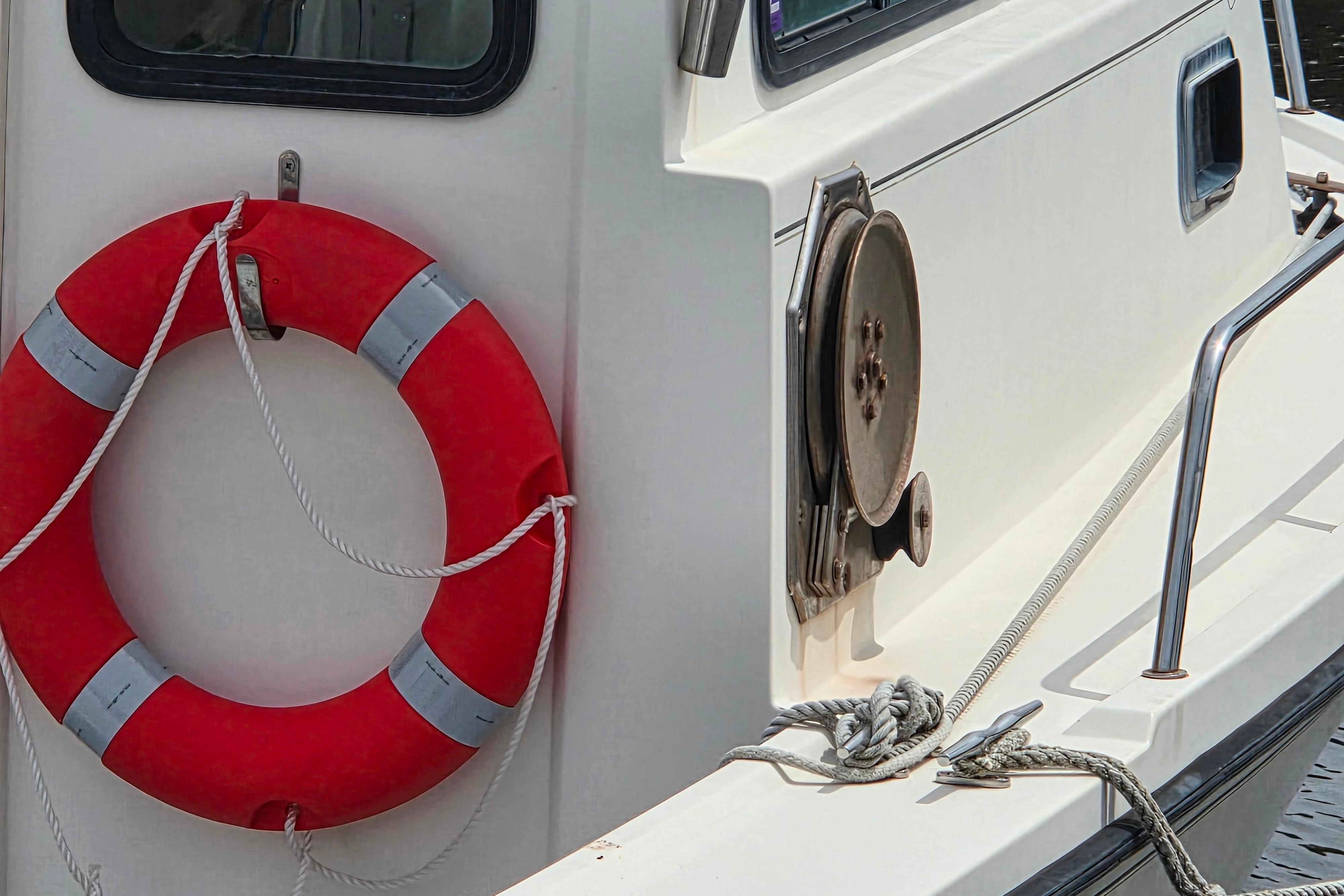 Red life ring on 2002 Parker 2520 Deep Vee Sport Cabin boat deck.