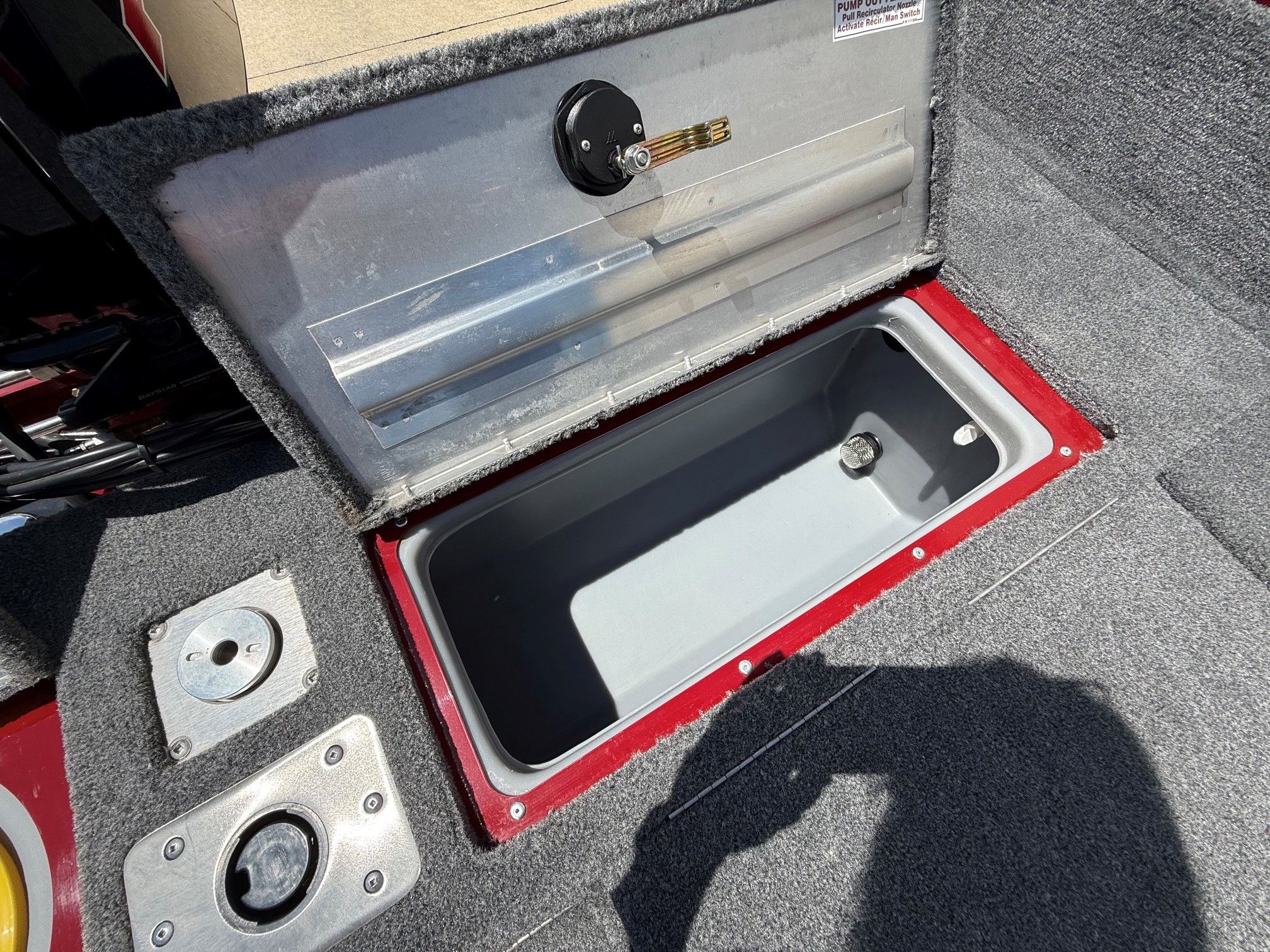 Tracker Pro Guide V175 2024 storage compartment with open lid.