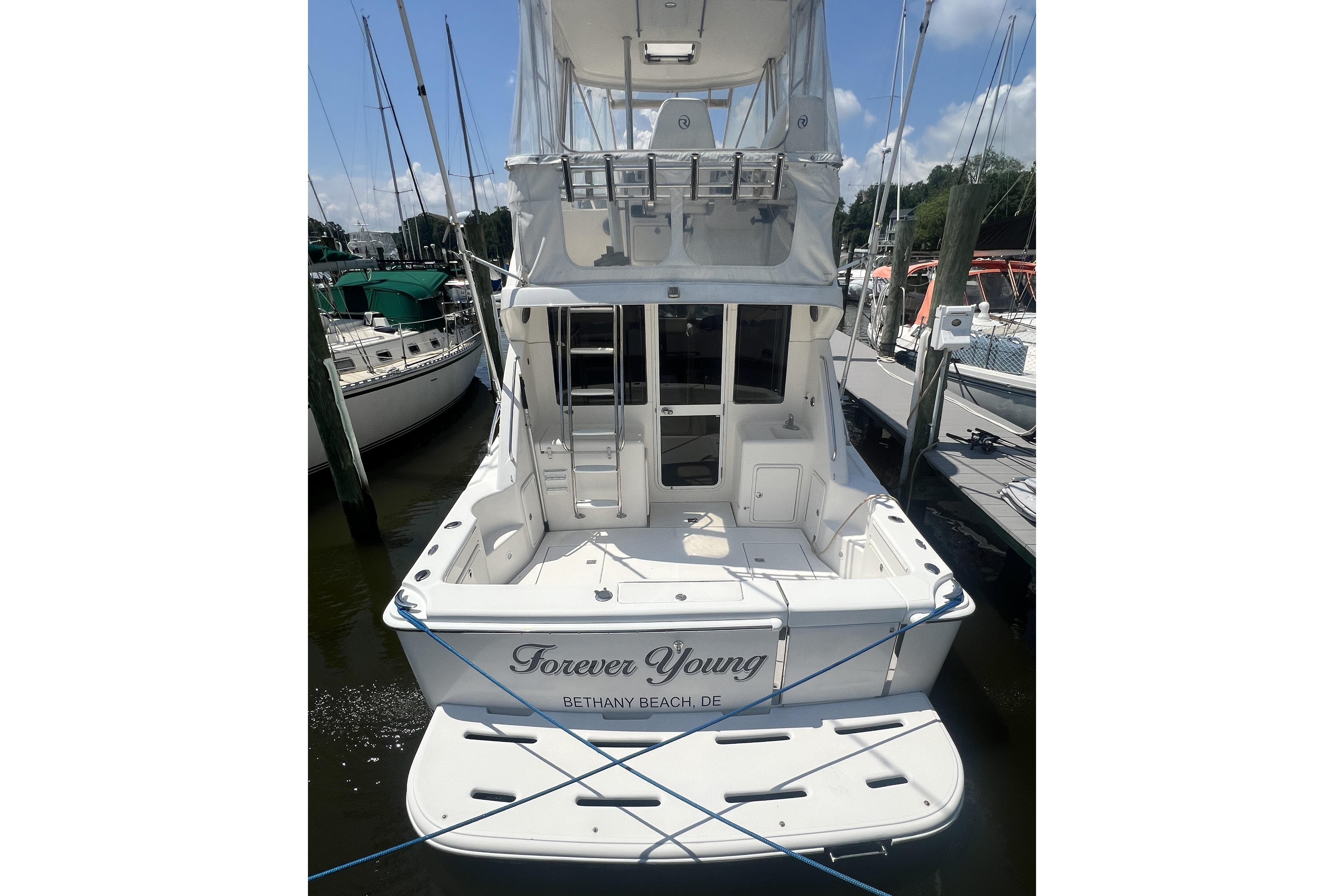 2007 Riviera 33 Flybridge yacht docked, named "Forever Young," at Bethany Beach, DE.