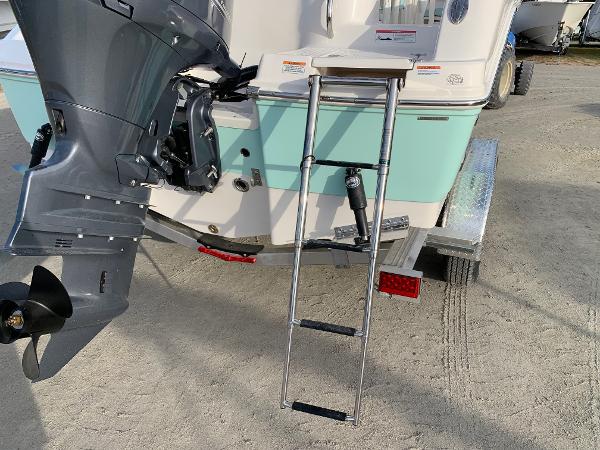 2024 Robalo R202 Explorer boat with outboard motor and ladder.