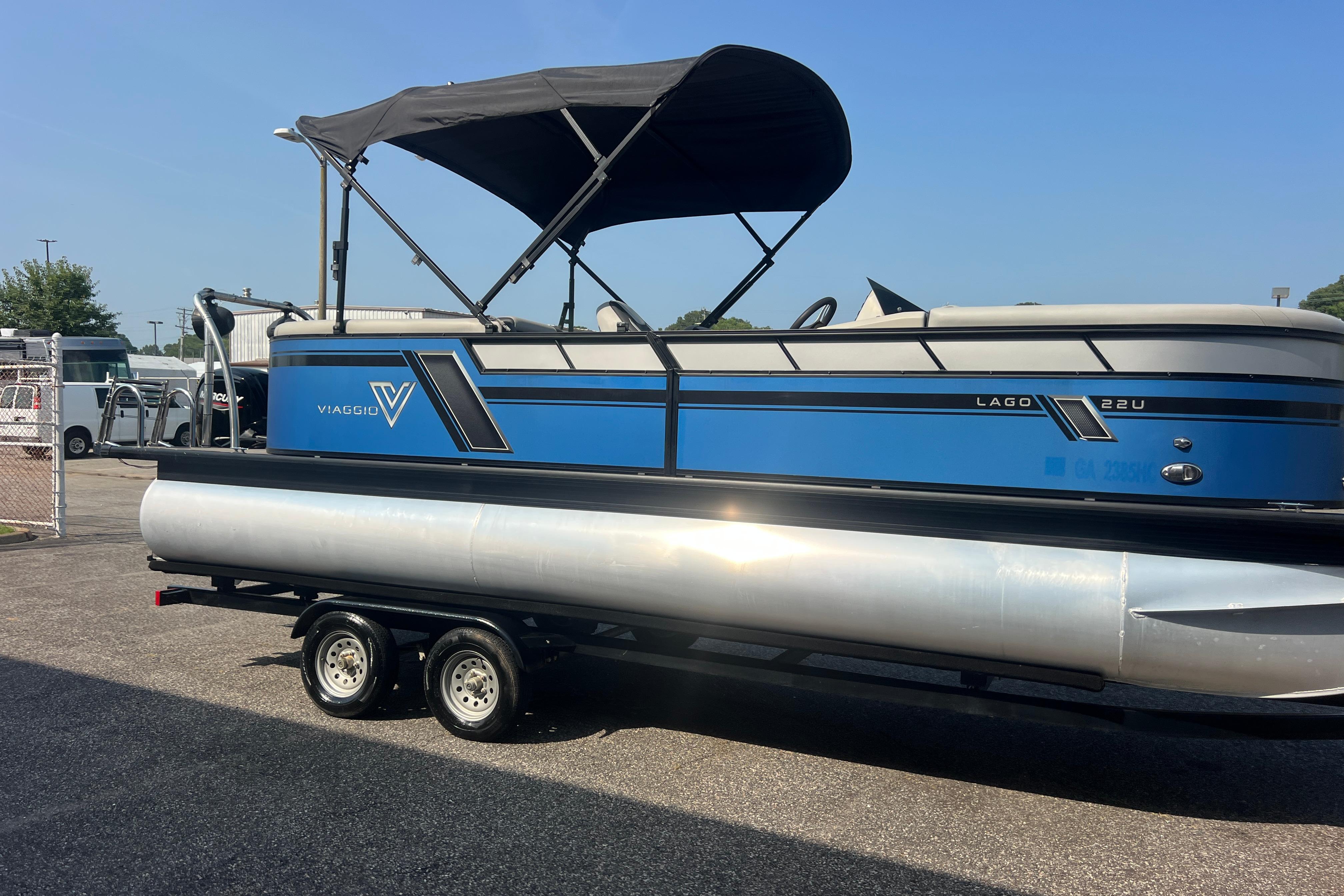 2022 Viaggio Lago V-U 22 pontoon boat on trailer, blue and silver design.