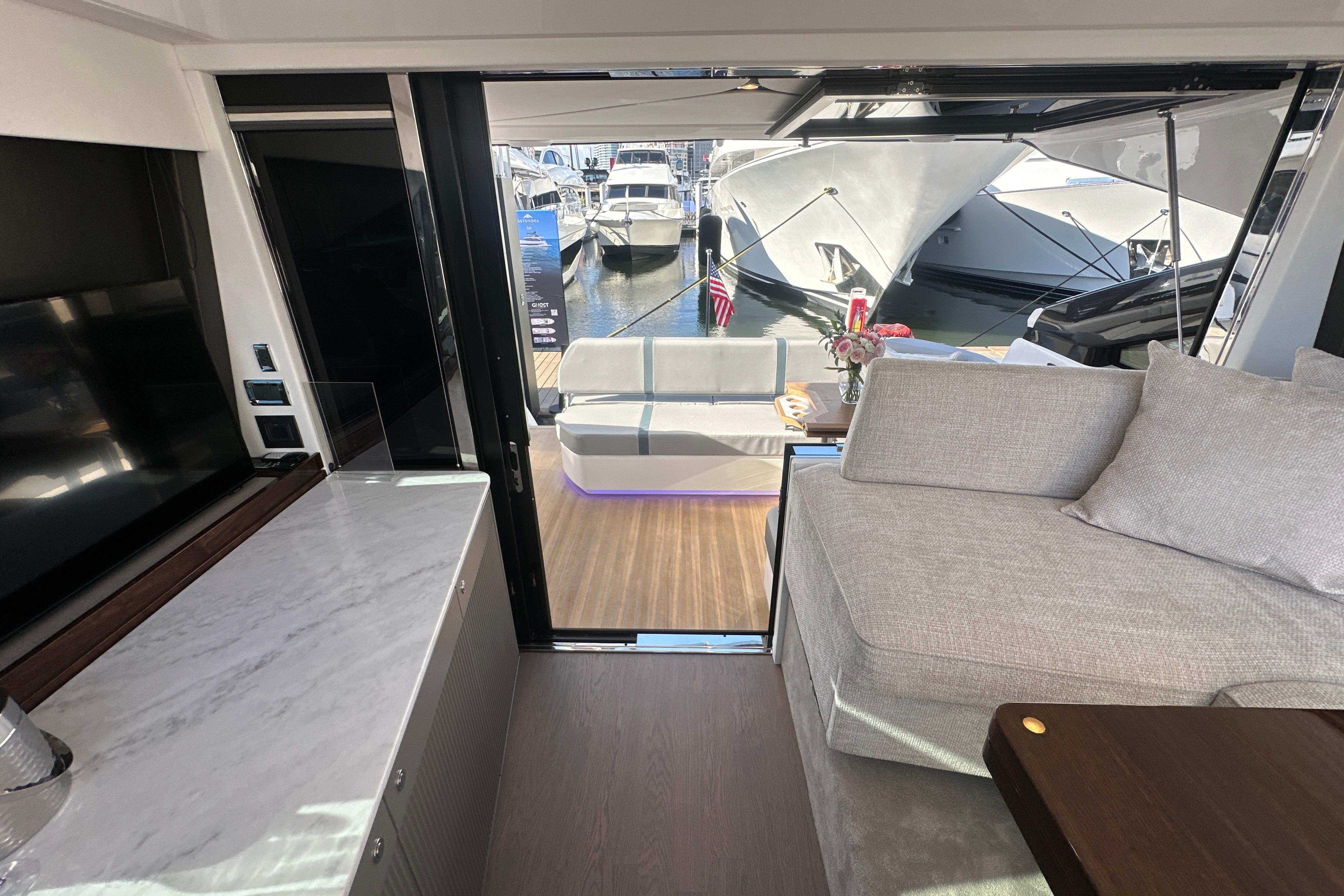 Luxurious interior of 2026 Fairline Targa 47 GT yacht with marina view.